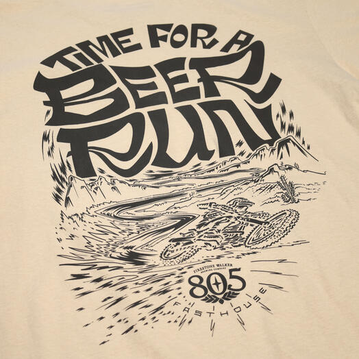 Close-up of 805 Desert Run Black Tee showing Black ink graphic on cream with desert landscape, bold lettering, and radiating