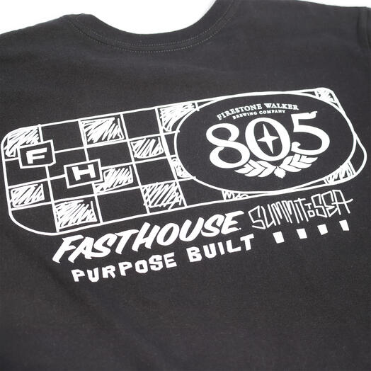 Close-up of 805 Purpose Black Tee showing White linework graphic with checkered flag pattern and oval 805 badge detail -