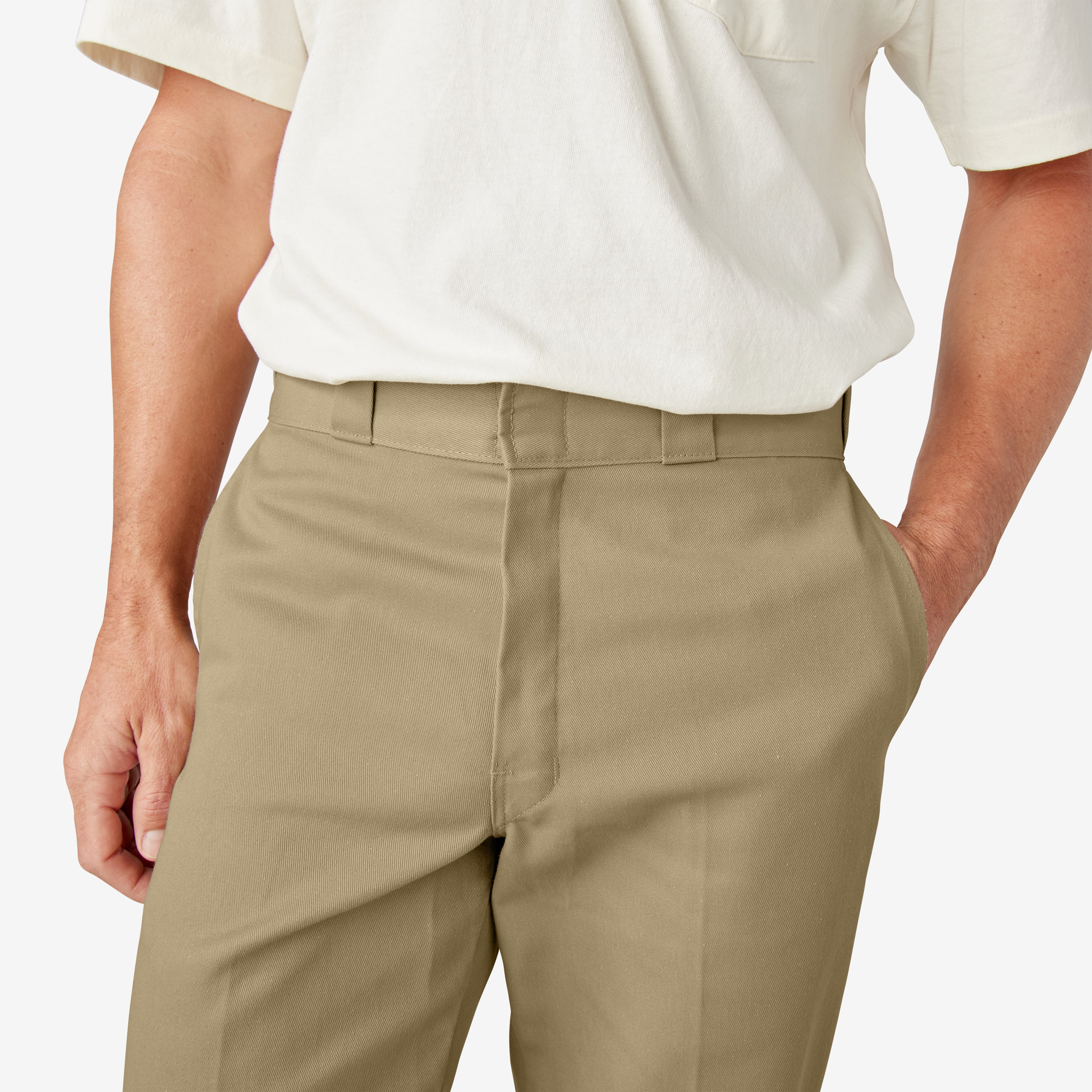 Person wearing 874 Original Work Pant Pants Black Pants, Man wearing cream short-sleeve shirt and tan work pants against