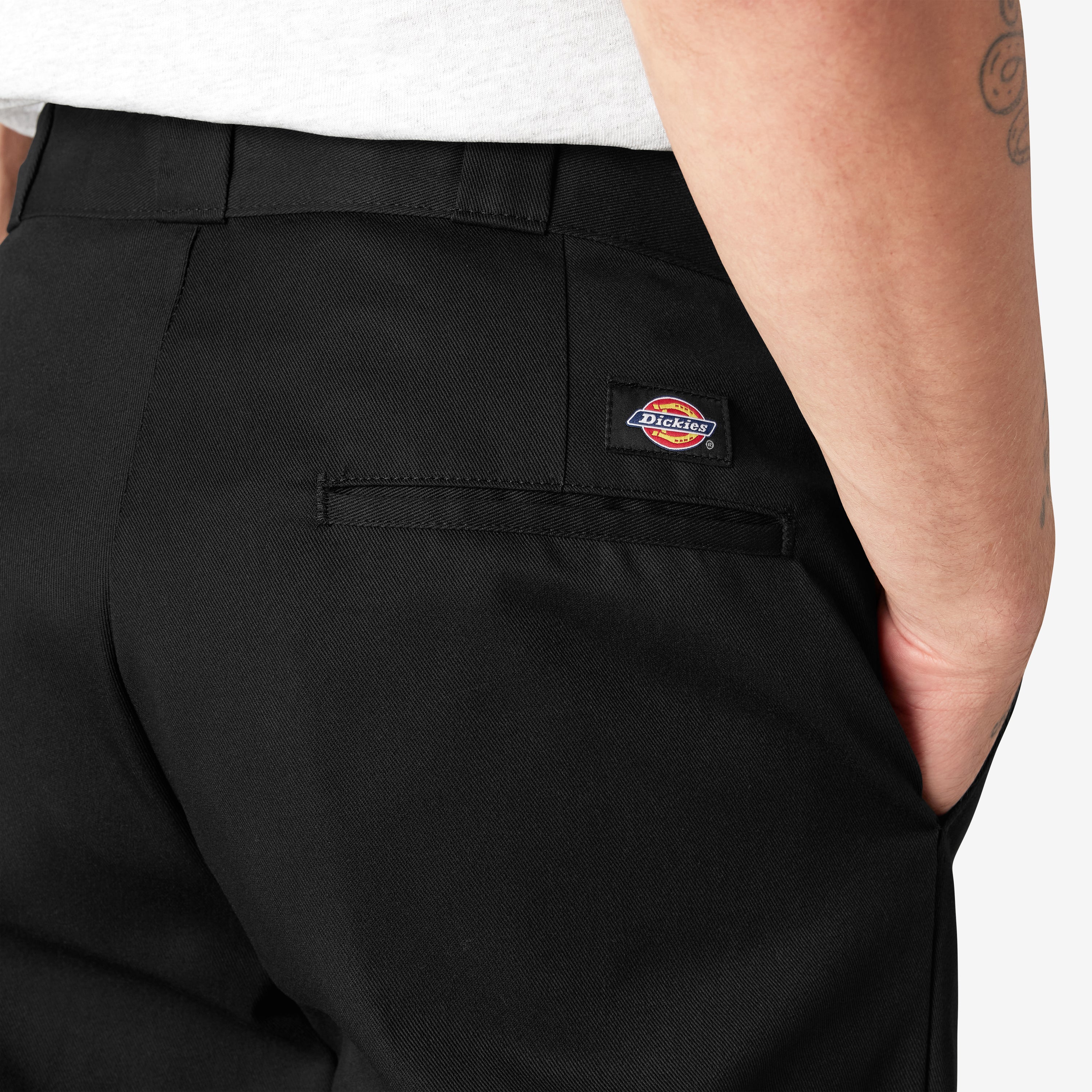 Person wearing 874 Original Work Pant Pants Black Pants, Man wearing black work pants with visible back pocket and brand