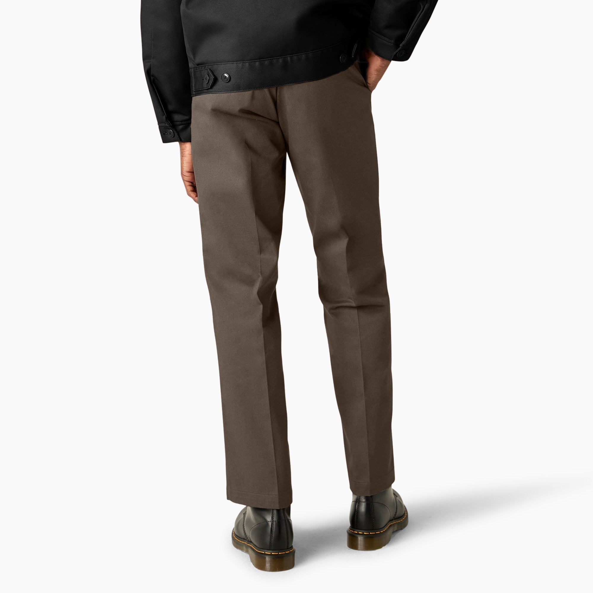 Person wearing 874 Original Work Pant Pants Black Pants, Olive-brown work pants worn against neutral studio background with