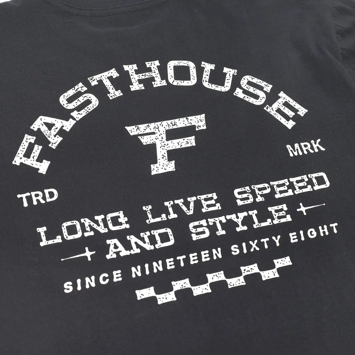 Close-up of Arthur Black Tee showing Distressed white lettering and racing graphic with speckled texture throughout print -