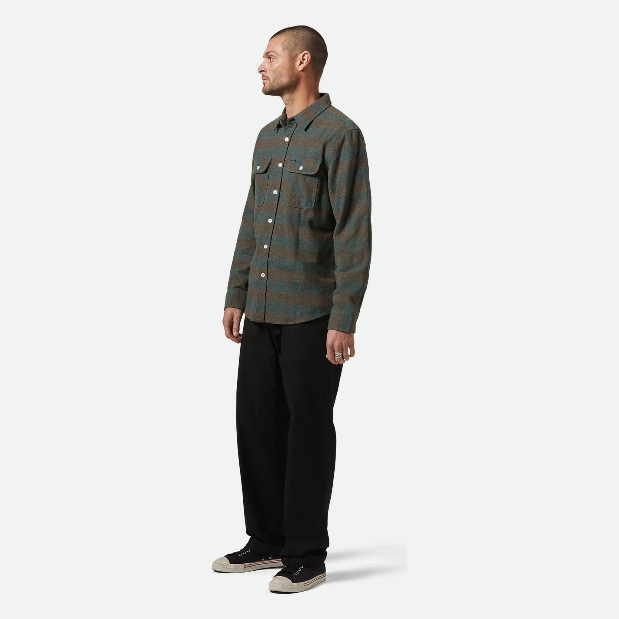 Person wearing Bowery Flannel Ocean L/S Woven L/S Woven, Man standing against neutral white background in casual pose -