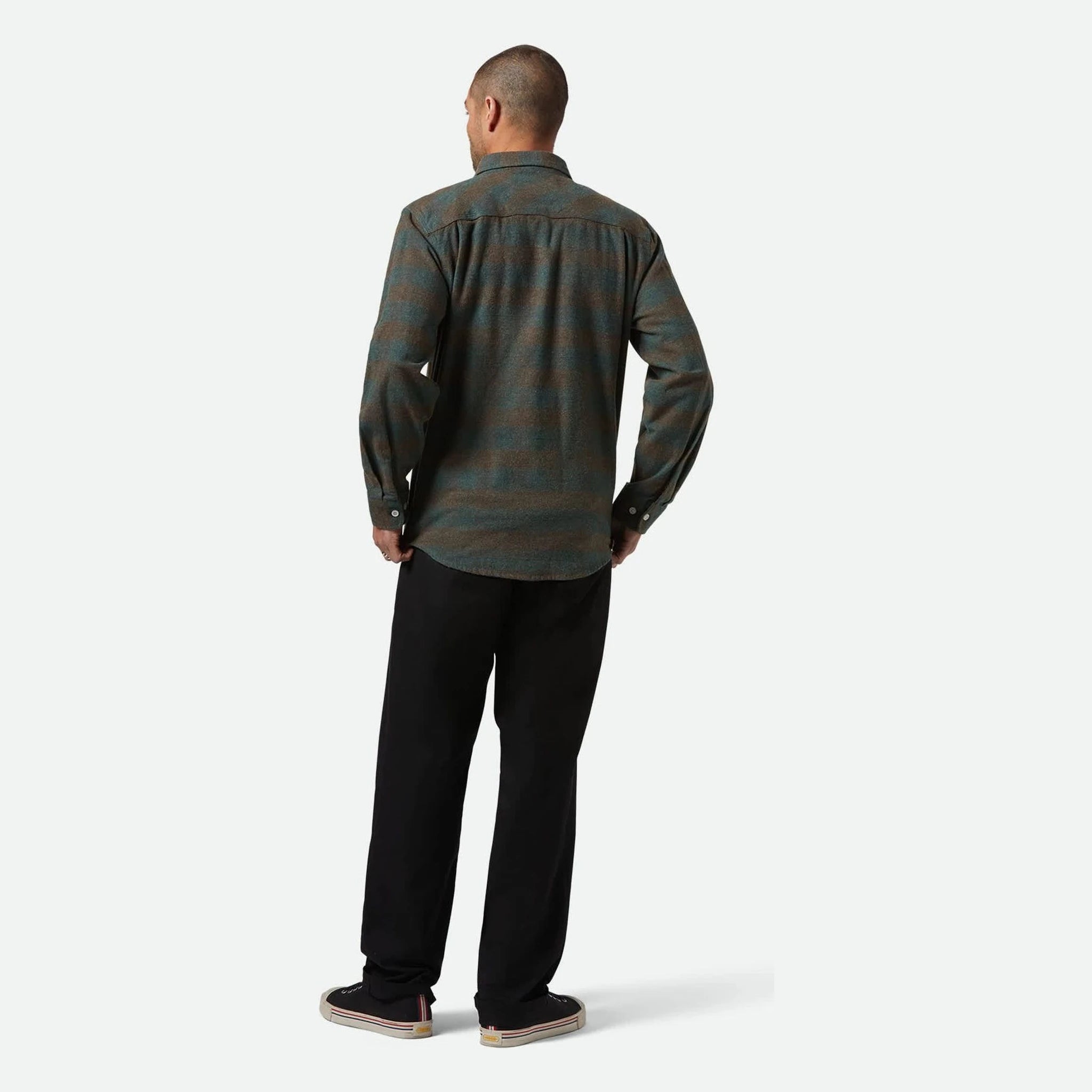 Person wearing Bowery Flannel Ocean L/S Woven L/S Woven, Neutral studio setting with white backdrop and flooring - Slowride