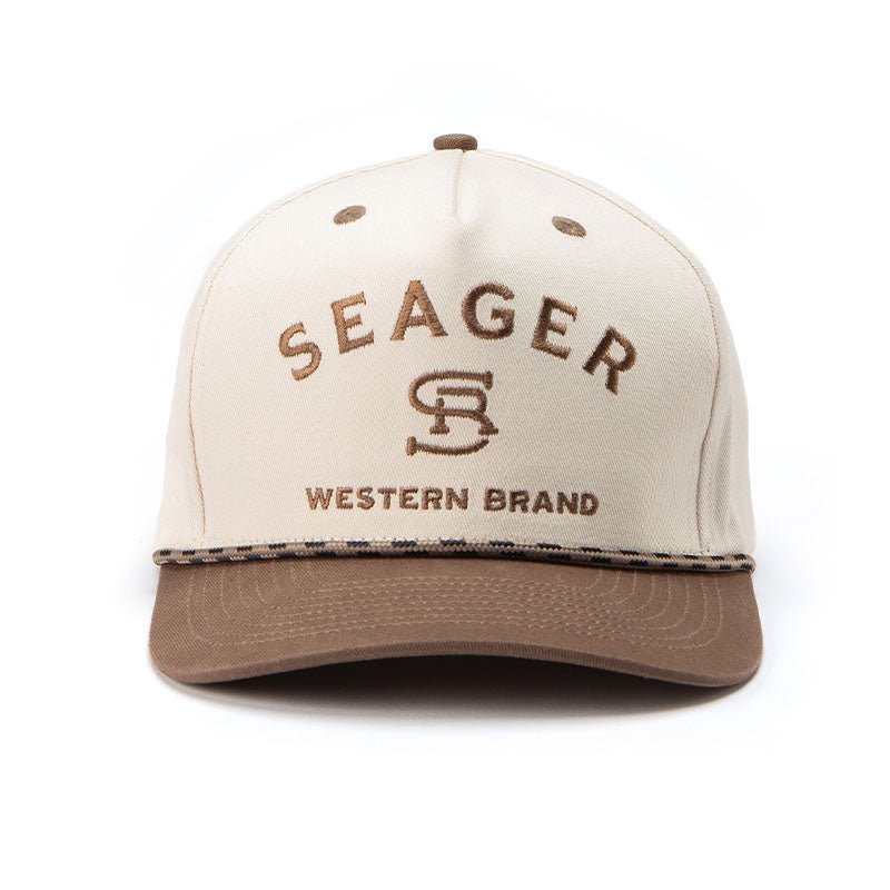 Close-up of Branded Snapback Cream/brown Hat showing Cream crown with brown embroidered lettering and monogram, tan visor