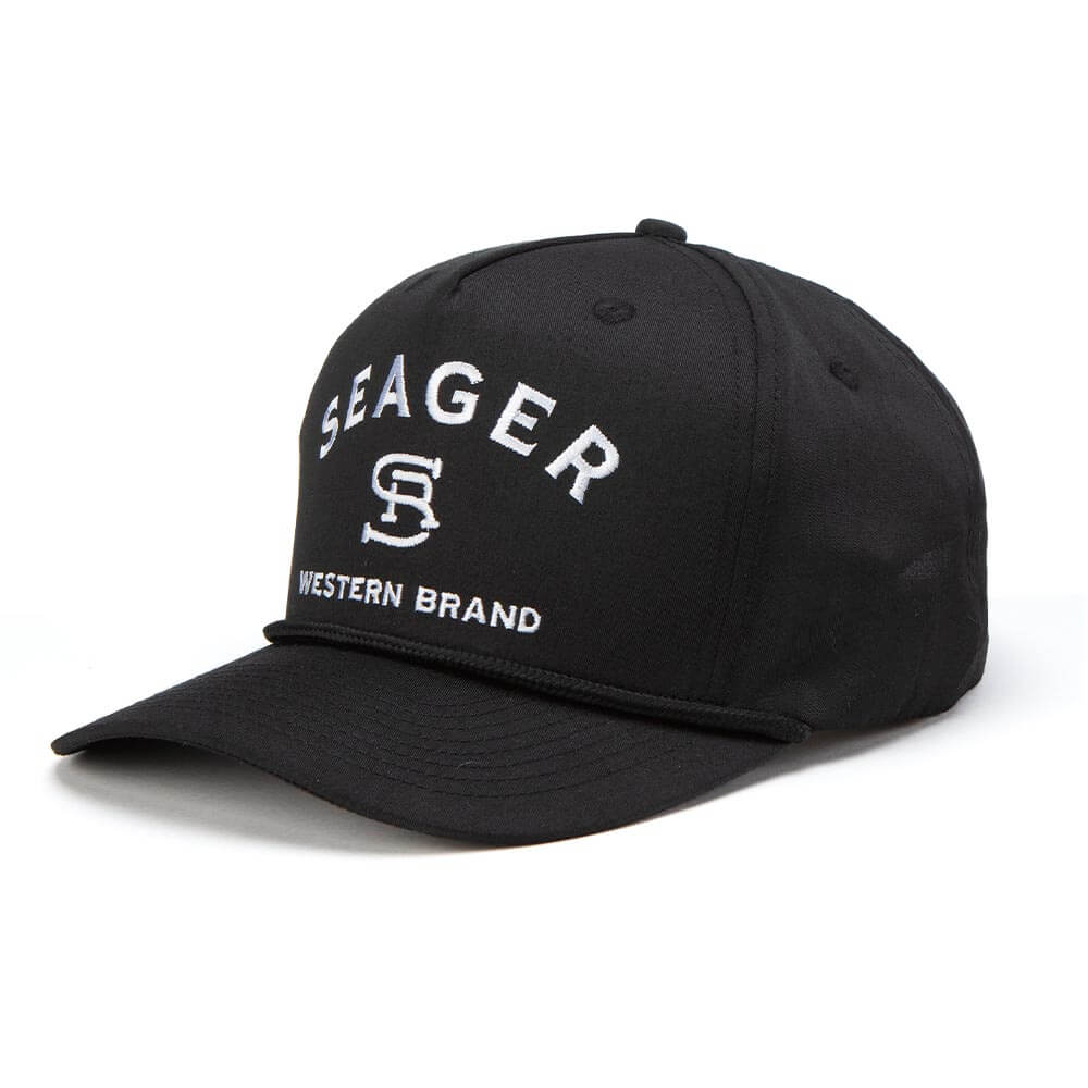 Close-up of Branded Trucker Black/Black Hat showing Black cotton twill cap with white embroidered "SEAGER" text,