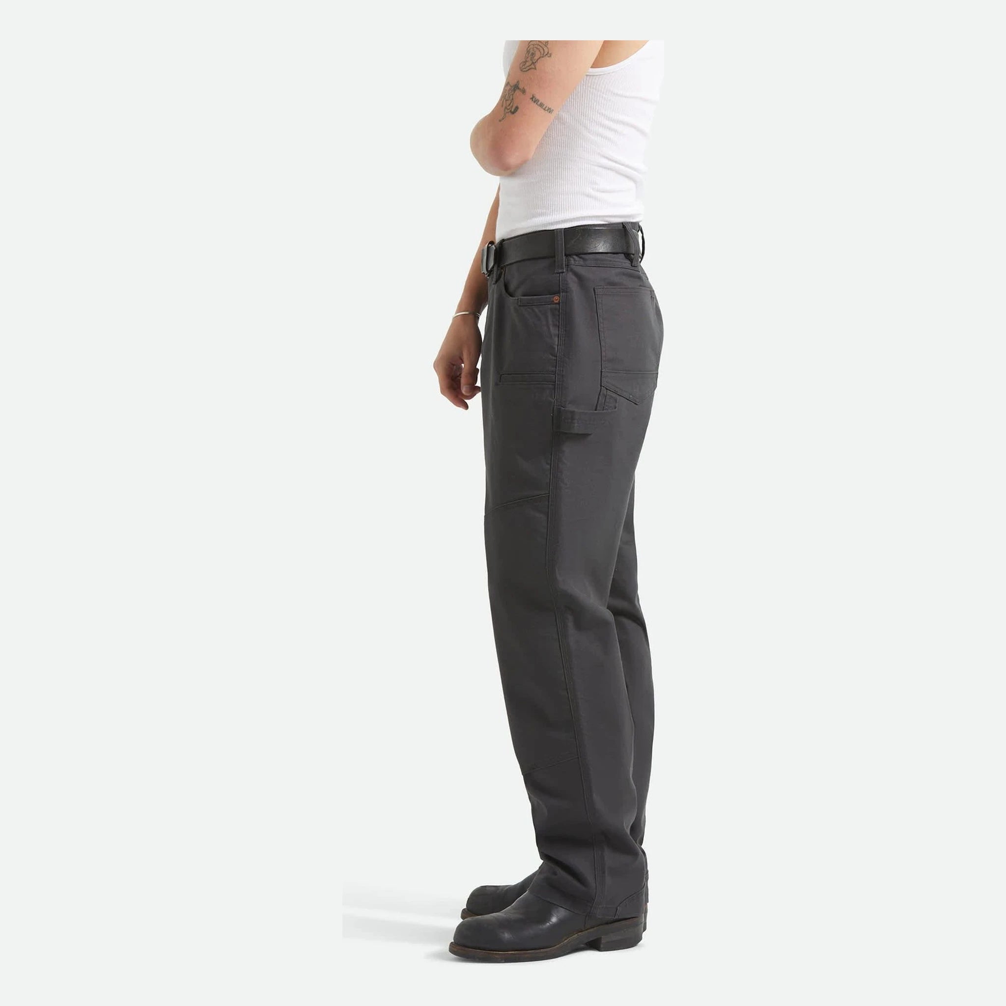Person wearing Builders Carpenter Pant Pants Washed Black Pants, Person standing against neutral white background wearing