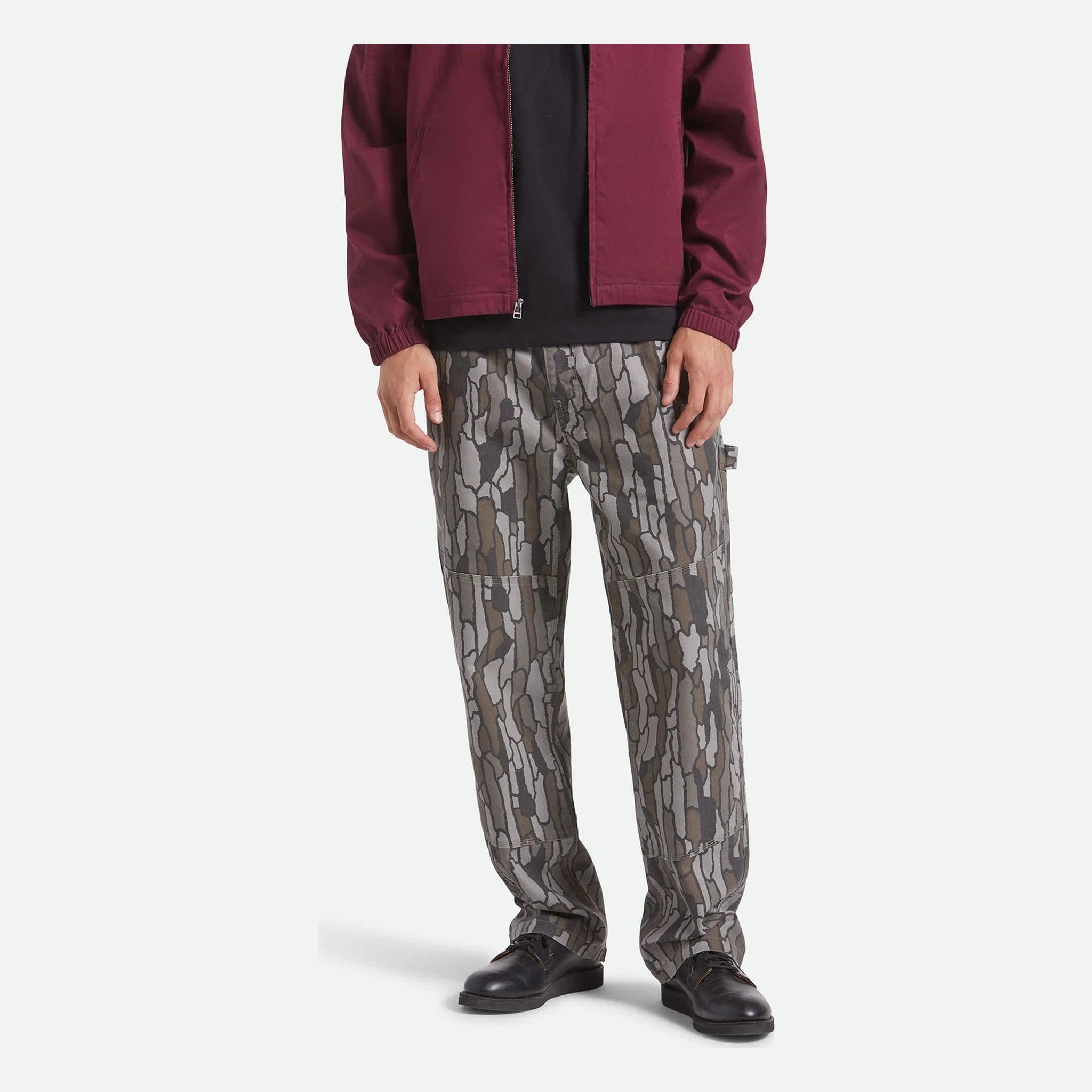 Person wearing Builders Carpenter Pant Pants Washed Black Pants, Model wearing gray and cream geometric patterned pants