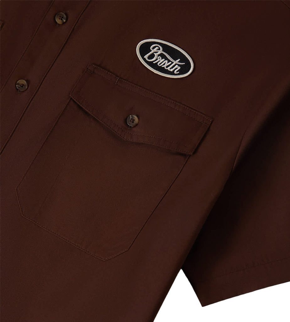 Close-up of Builders Olson S/s Woven Apparel Chocolate Apparel showing Chest pocket with button closure and embroidered oval