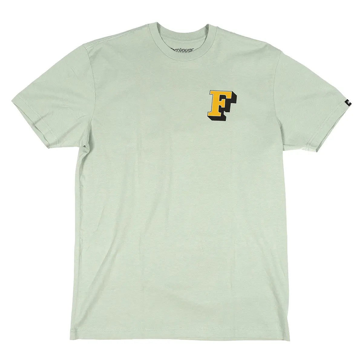 Close-up of Champions Choice Sage Tee showing Sage tee with yellow and black F logo on chest, small brand tab on right