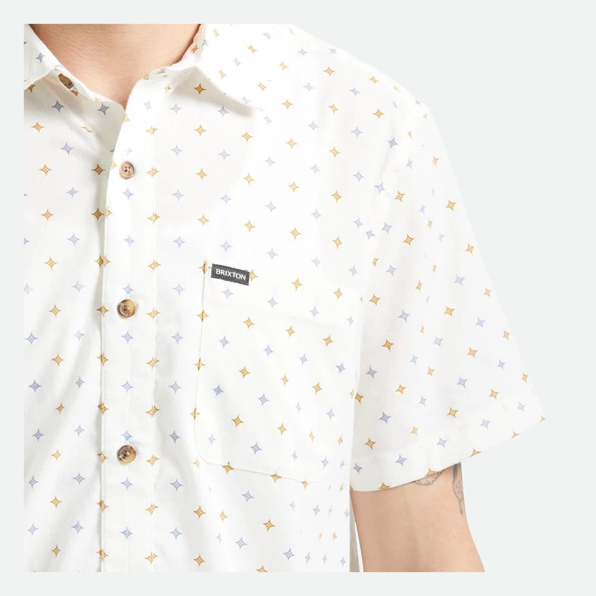 Person wearing Charter Print SS Woven S/S Woven Future Grey/ Diamond Tile S/S Woven, White shirt with scattered four-point