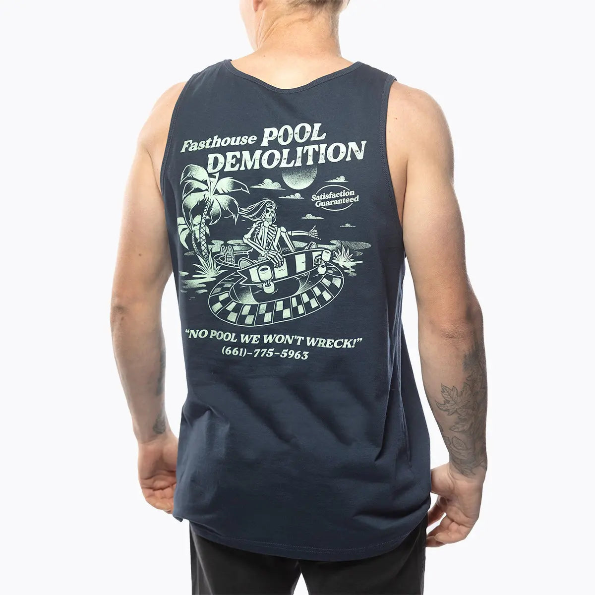 Person wearing Demolition Tank Top Navy Tank Top, Man wearing navy tank top against white backdrop - Slowride Supply