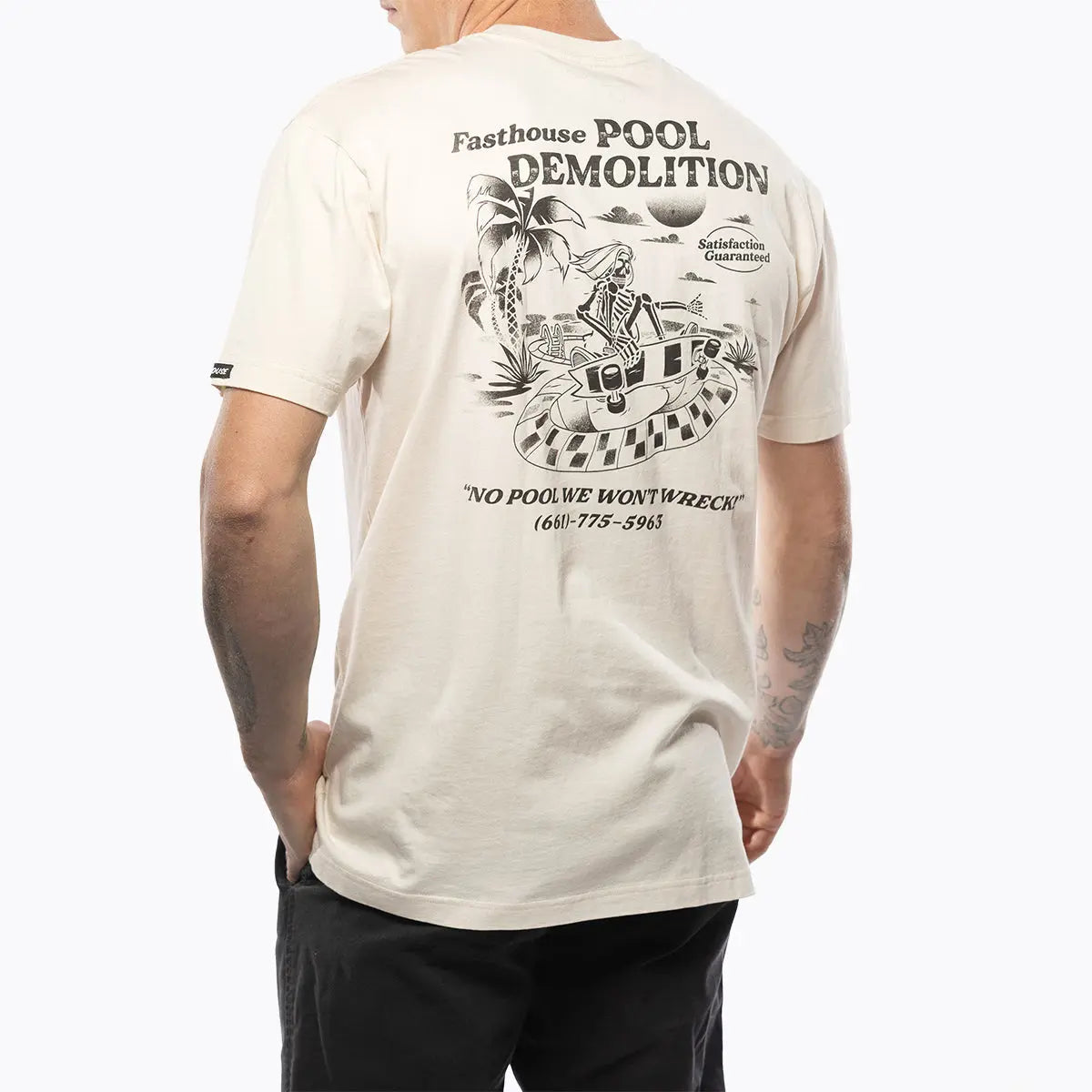 Person wearing Demolition Black Tee, Worn casually in a neutral studio setting against white background - Slowride Supply