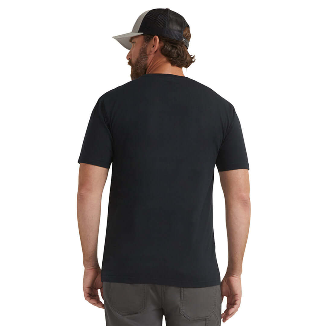 Person wearing DHCM Classic Black Tee, Man wearing black tee, photographed against white studio background - Slowride Supply