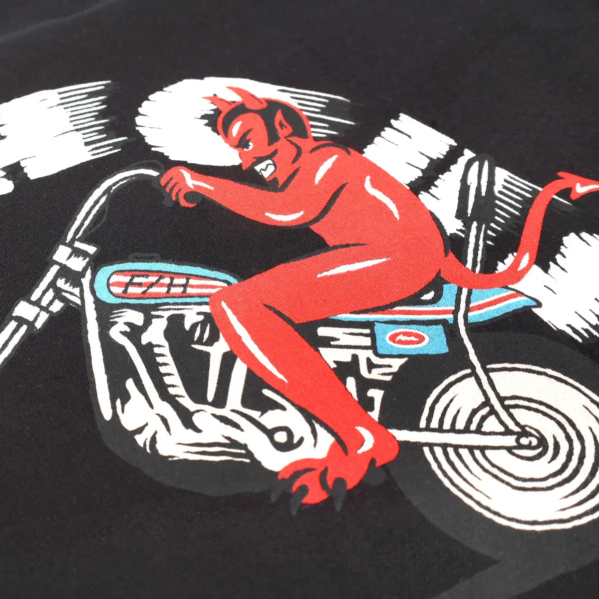 Close-up of Fallen Black Tee showing Red demon figure on motorcycle with white and black linework detail - Slowride Supply