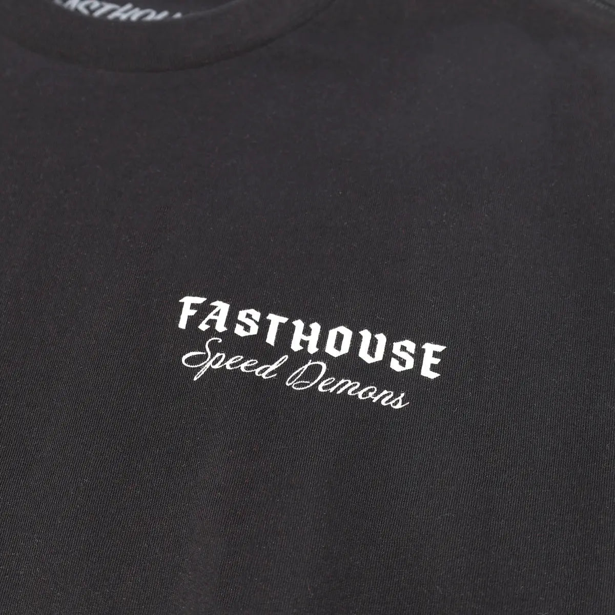 Close-up of Fallen Black Tee showing White embroidered text reading "Fasthouse" with script subtitle "Speed Demons" on black
