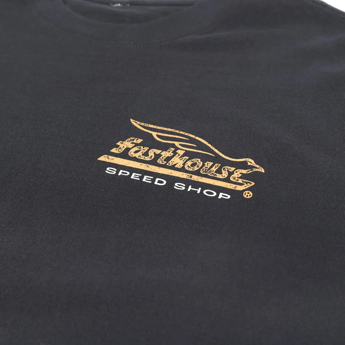 Close-up of Gilmore Black Tee showing Gold and white embroidered winged logo with speed shop text on chest - Slowride Supply