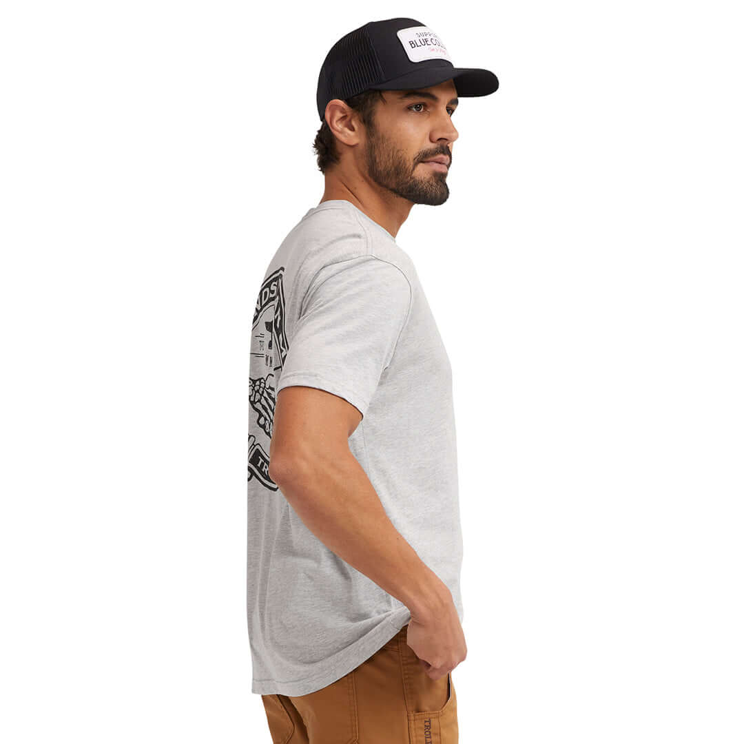 Person wearing Haggler Black Tee, Studio setting with white background, model in profile wearing cap and casual tee -