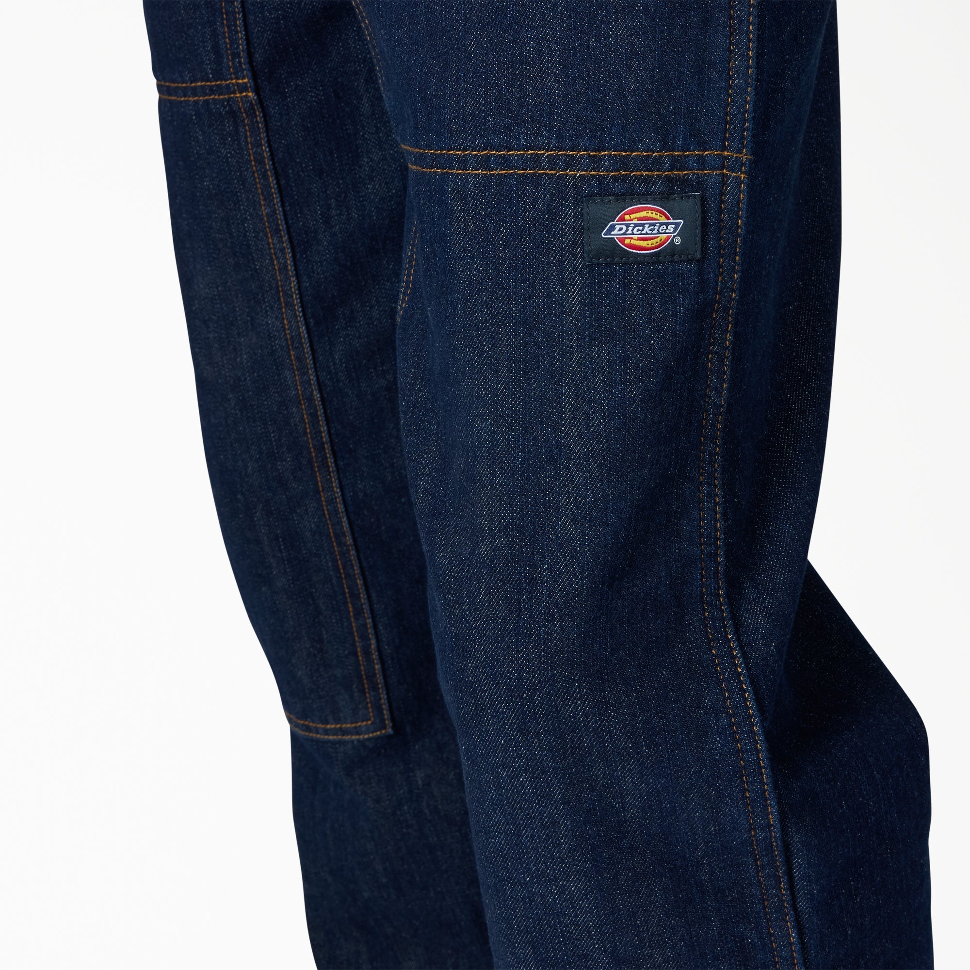 Close-up of Hdxdickies Denim Pant RNB Pants Pants showing Small woven label with red and blue oval logo on dark denim pocket
