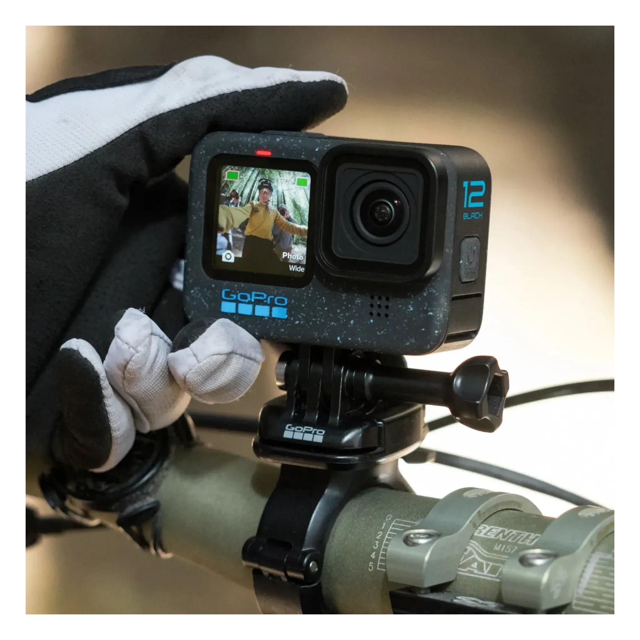 Person wearing Hero 12 Camera Black Camera, Hand in black and white glove holding action camera mounted on rifle scope in