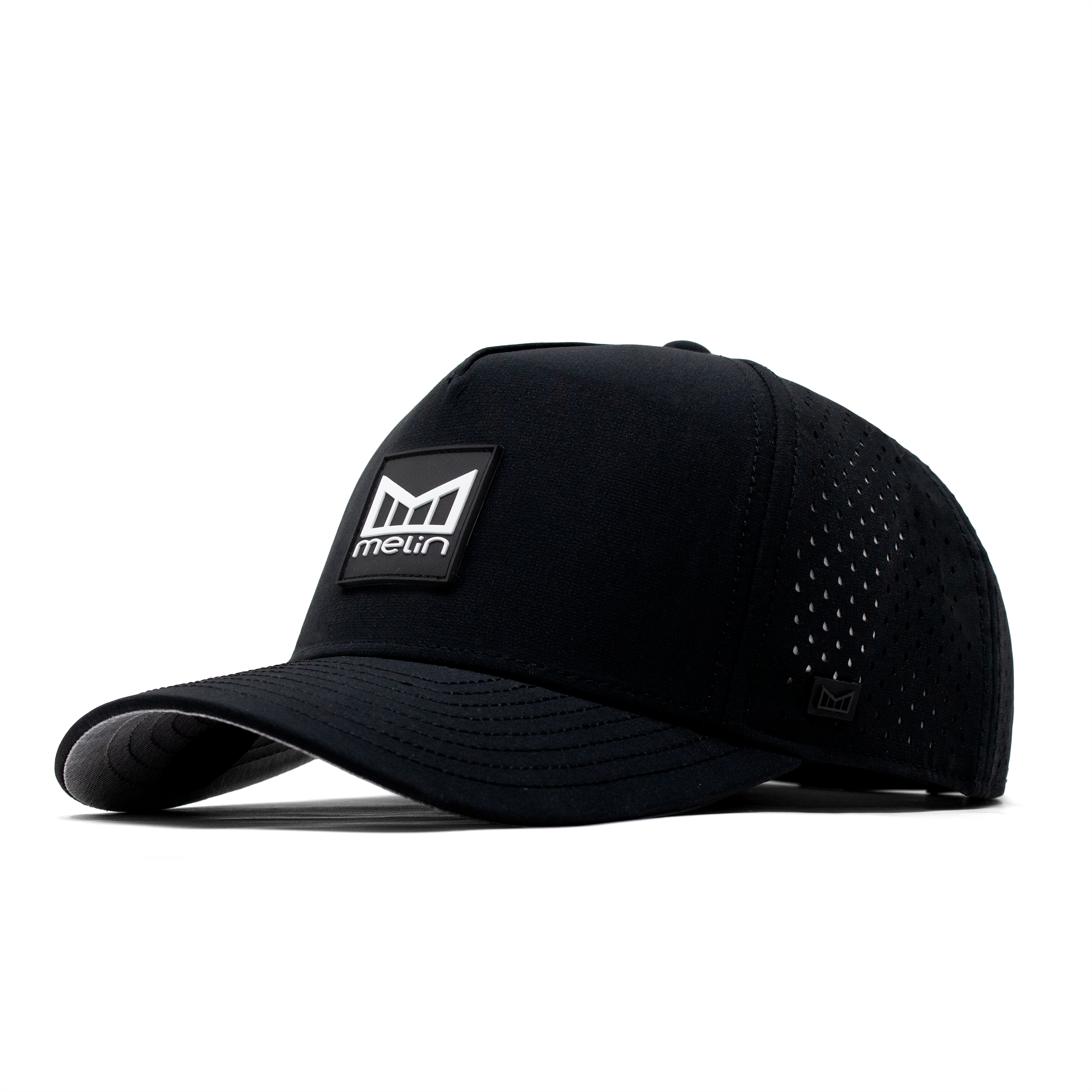 Close-up of Hydro Odyssey Stacked Black Camo Hat showing Black mesh trucker cap with perforated side panels and woven brand