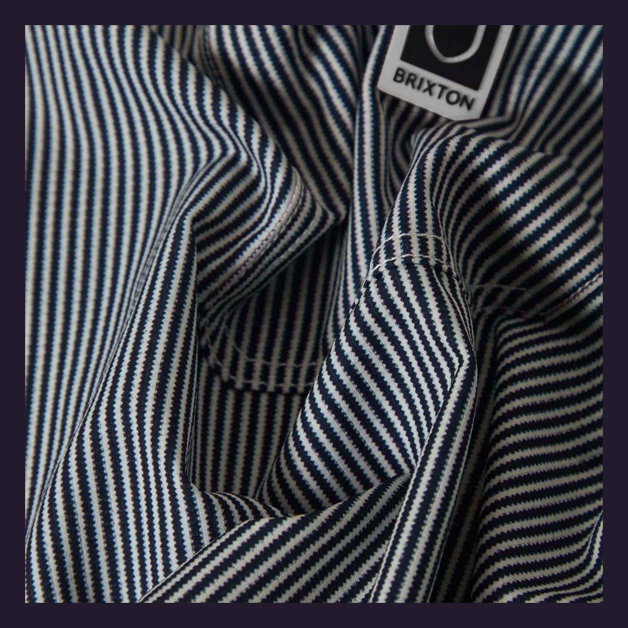 Close-up of Journey LW SS Woven Navy/white Stripe S/S Woven S/S Woven showing Navy and white vertical stripe weave with