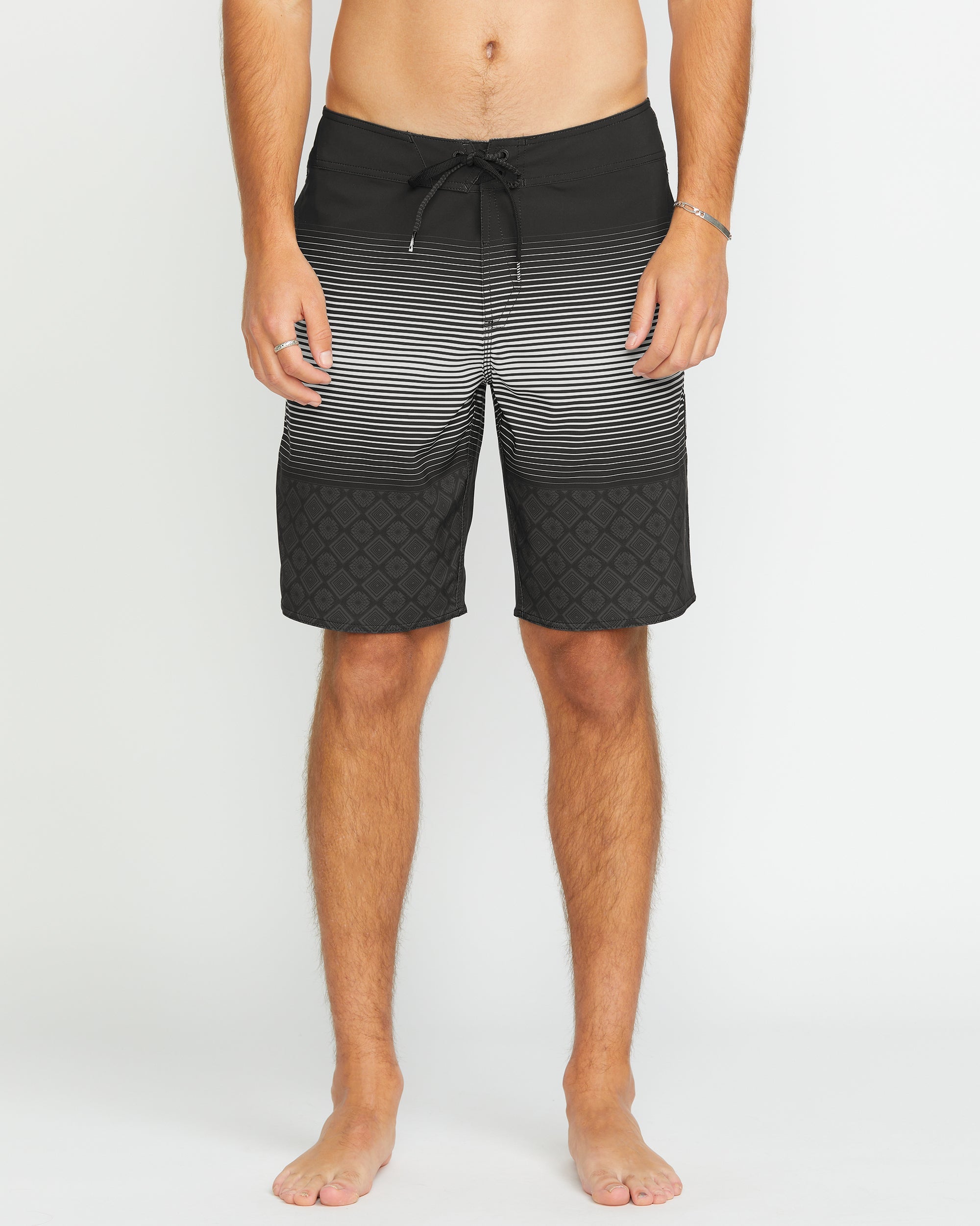 Person wearing Lido Stripe Mod 20" Boardshorts Black Boardshorts, Neutral studio setting with plain white background -