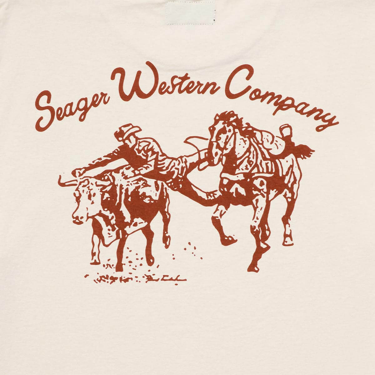Close-up of Los Rios Vintage Black Tee showing Rust-colored print texture showing bucking horse and rider illustration with