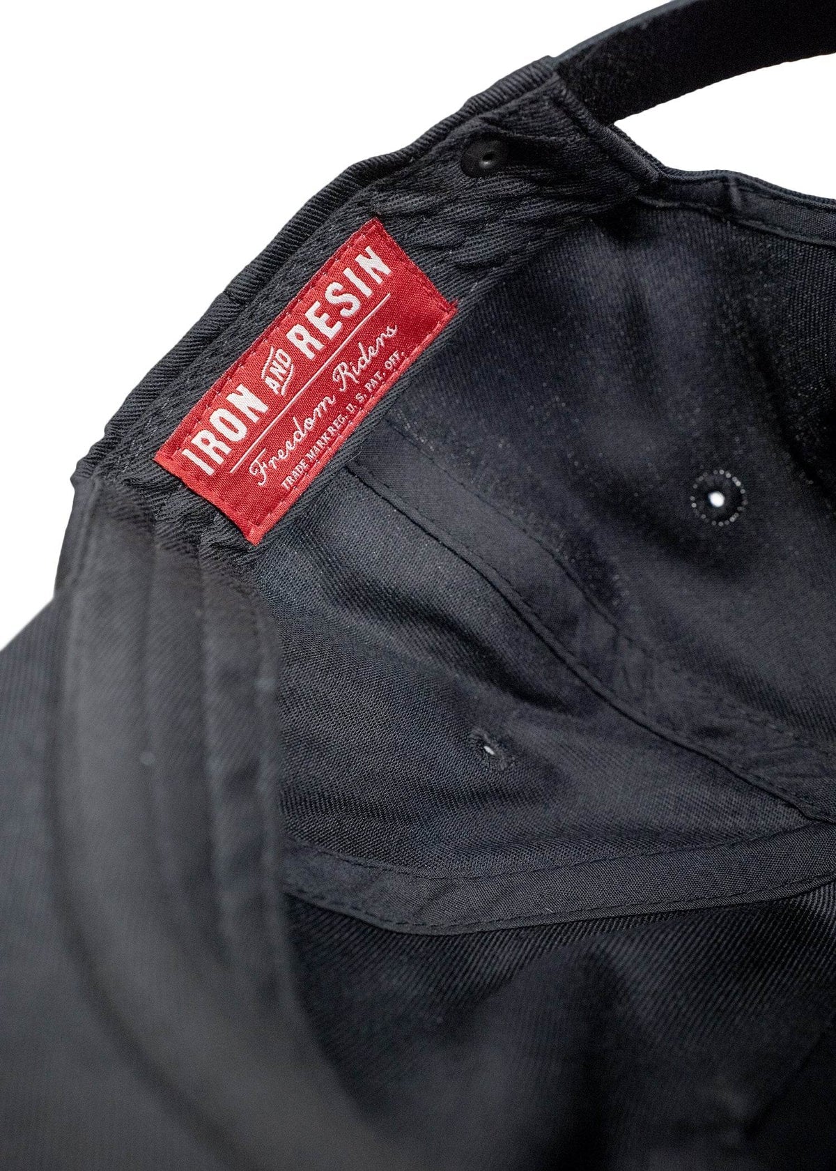 Back of Mama Tried Hat, Red woven label with white text and script lettering on black fabric back - Slowride Supply