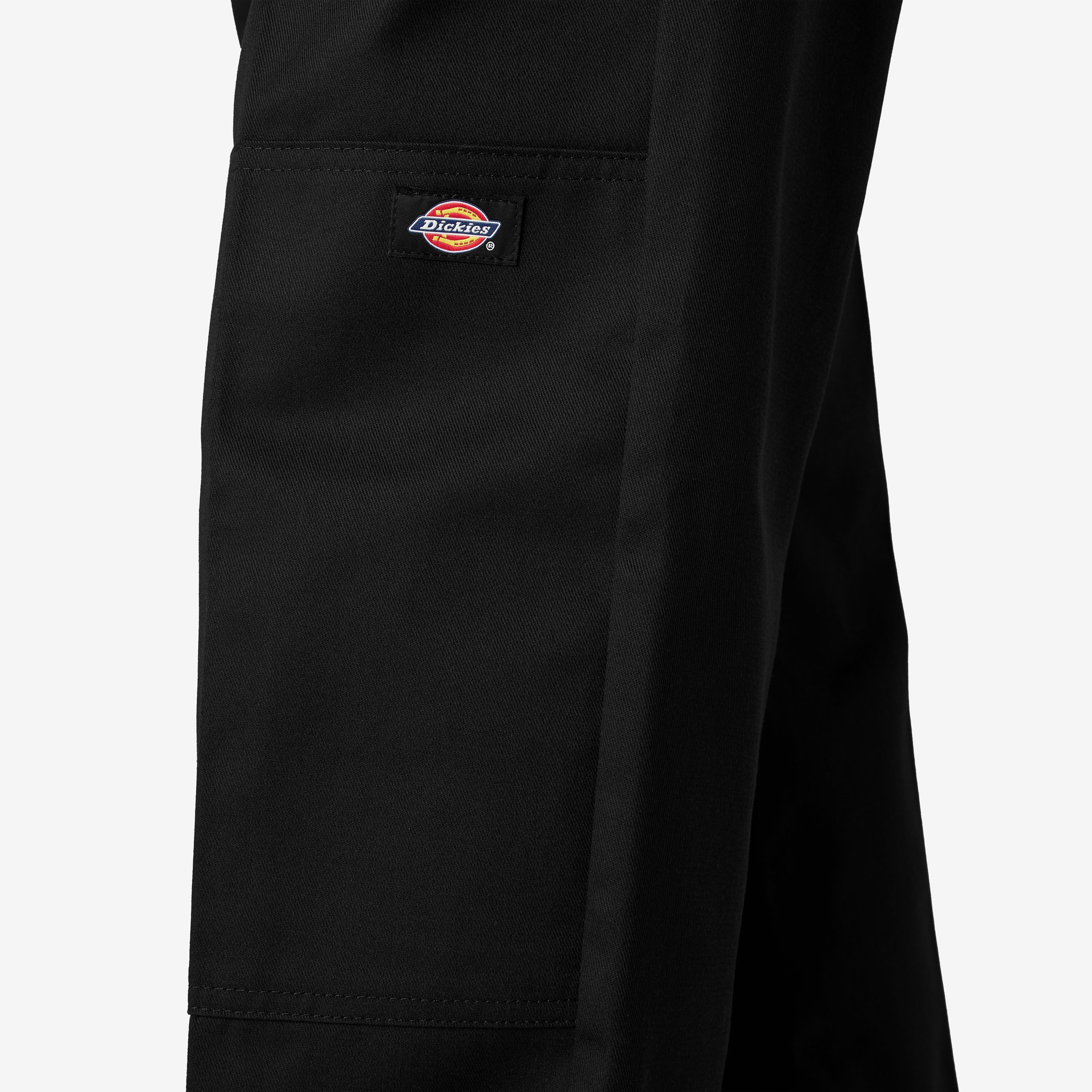 Close-up of Mens Twill Double Knee Work Pant (85283) Pants Dark Brown Pants showing Small woven brand label with red and