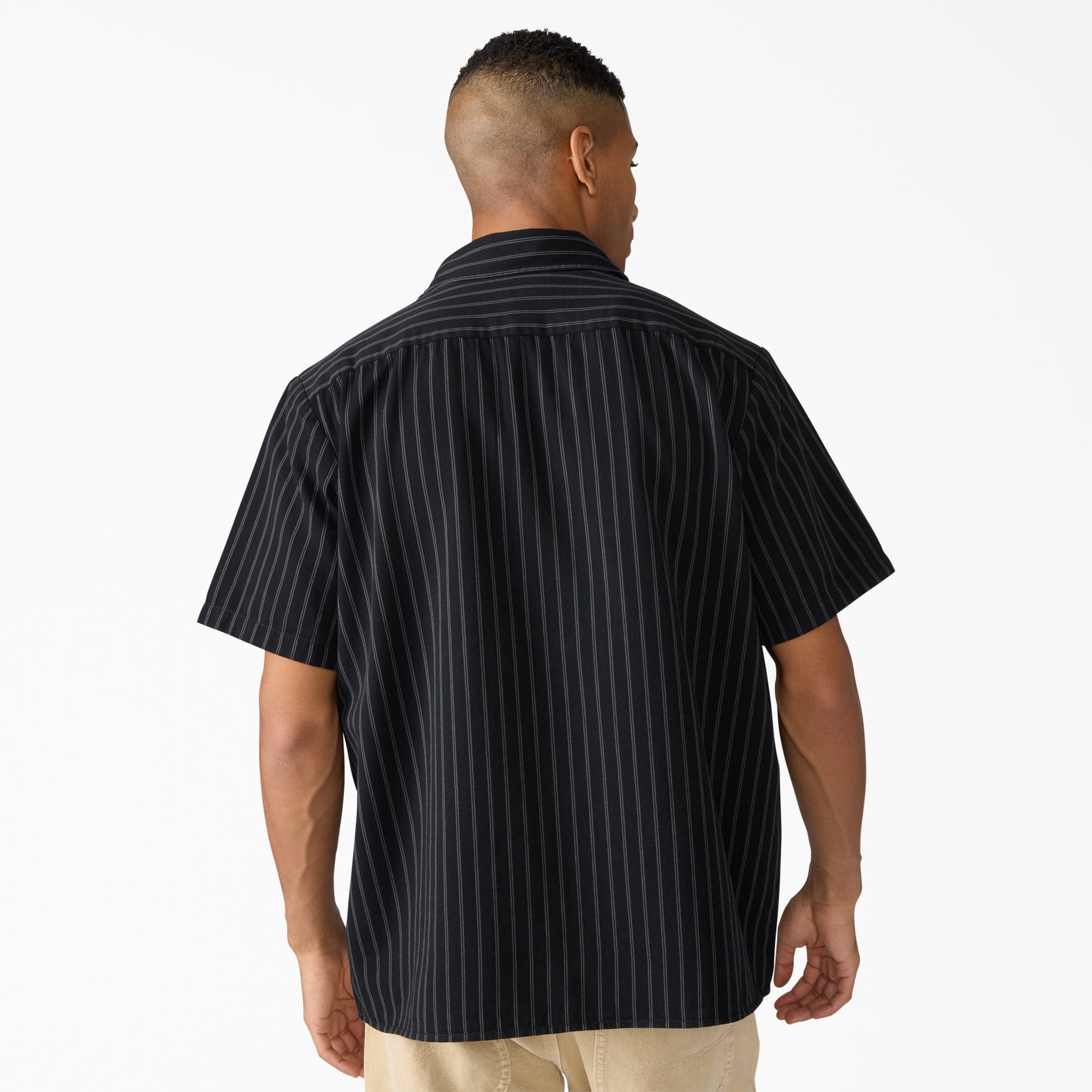 Person wearing Mens Worn in Lightweight Work Shirt S/S Woven Black S/S Woven, Man wearing black pinstriped shirt against