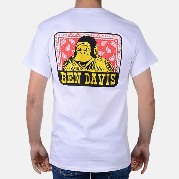 Back of Paisley Black Tee, Back graphic of yellow portrait with red paisley background and black banner with yellow text -