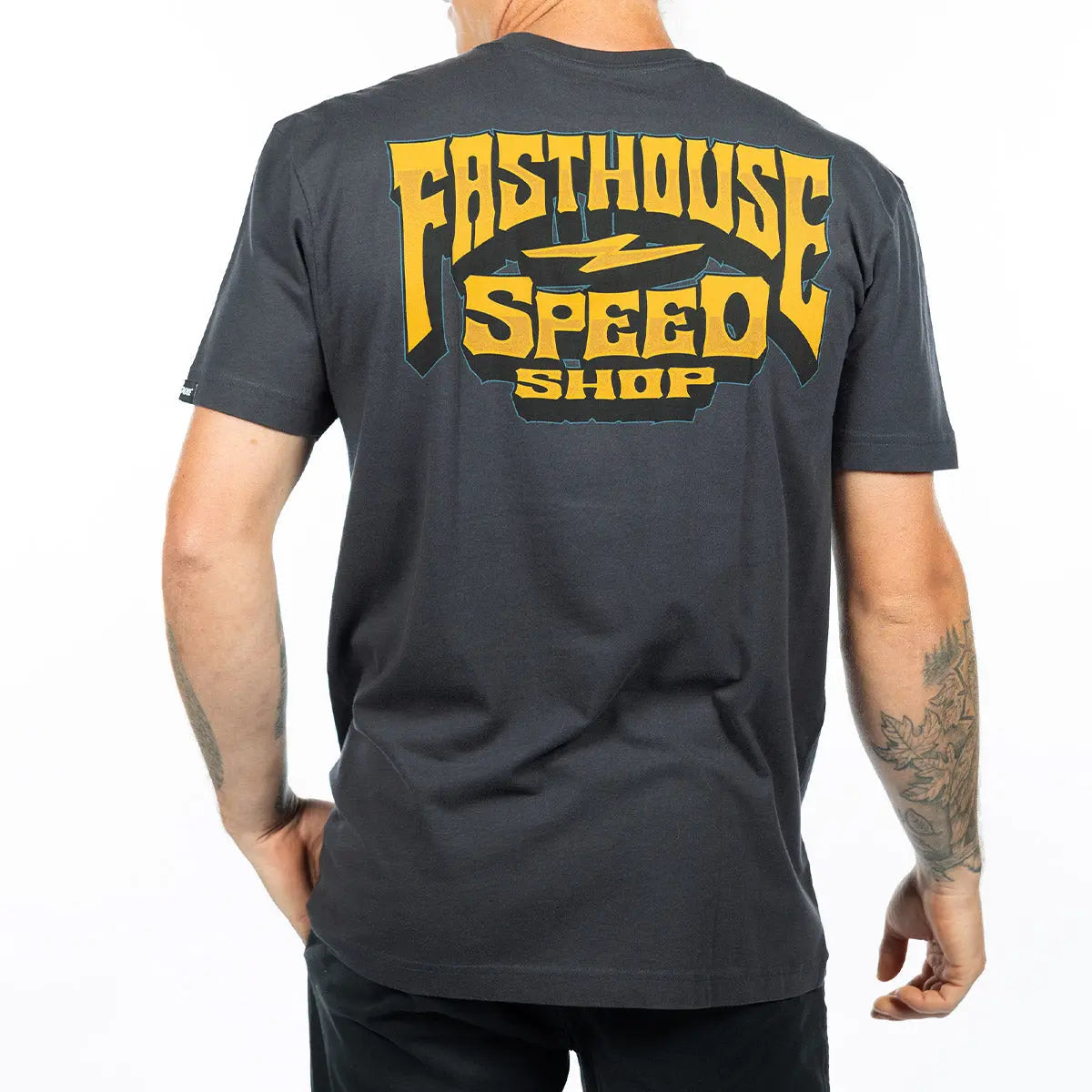 Person wearing Record Natural Tee, Man wearing charcoal tee standing indoors against neutral background - Slowride Supply