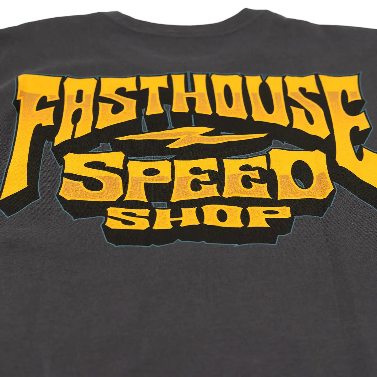 Close-up of Record Natural Tee showing Printed graphic detail showing yellow and black speedshop logo with outlined border
