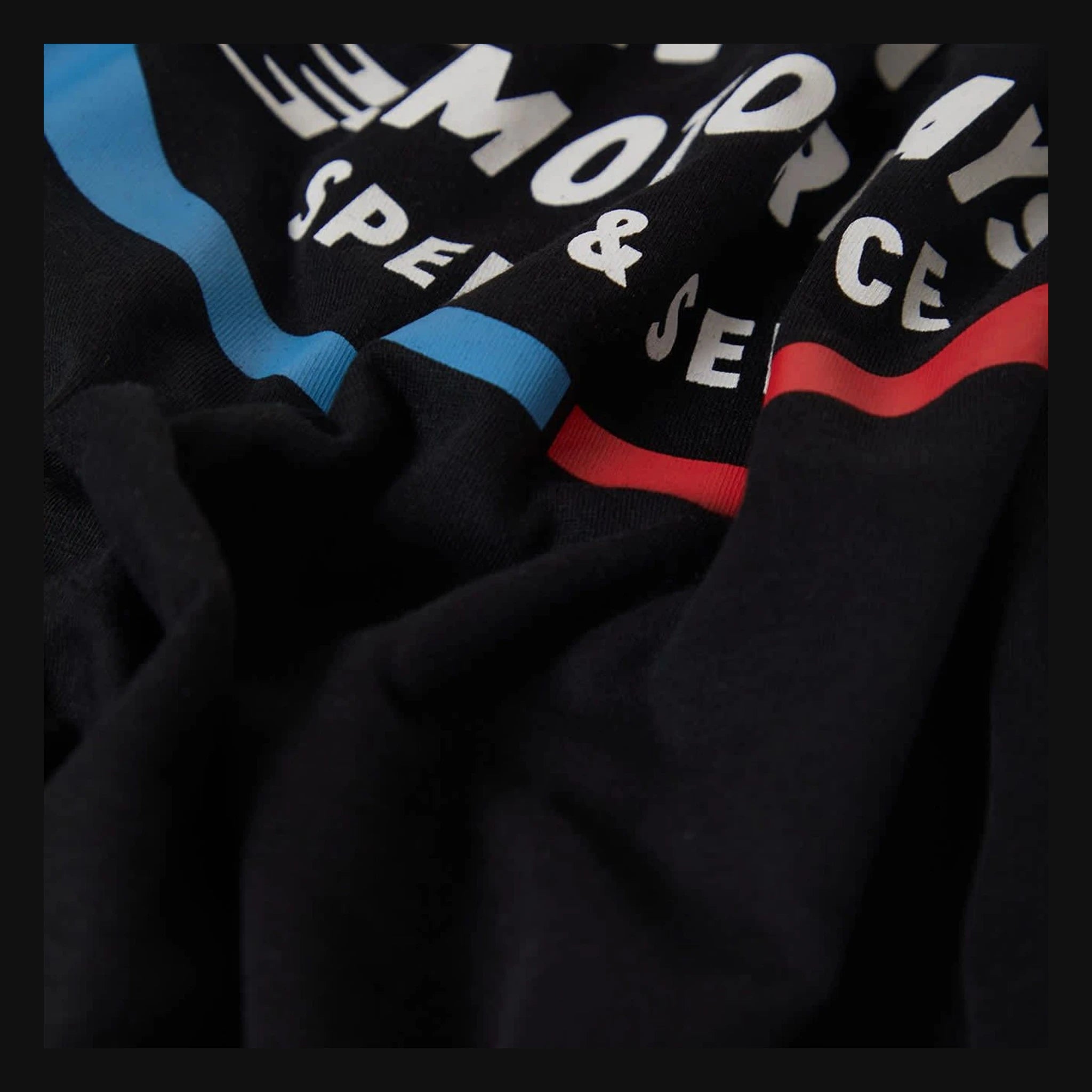 Close-up of Rhett Tank Top Apparel Black Apparel showing Ribbed crew neck trim with blue and red binding detail - Slowride