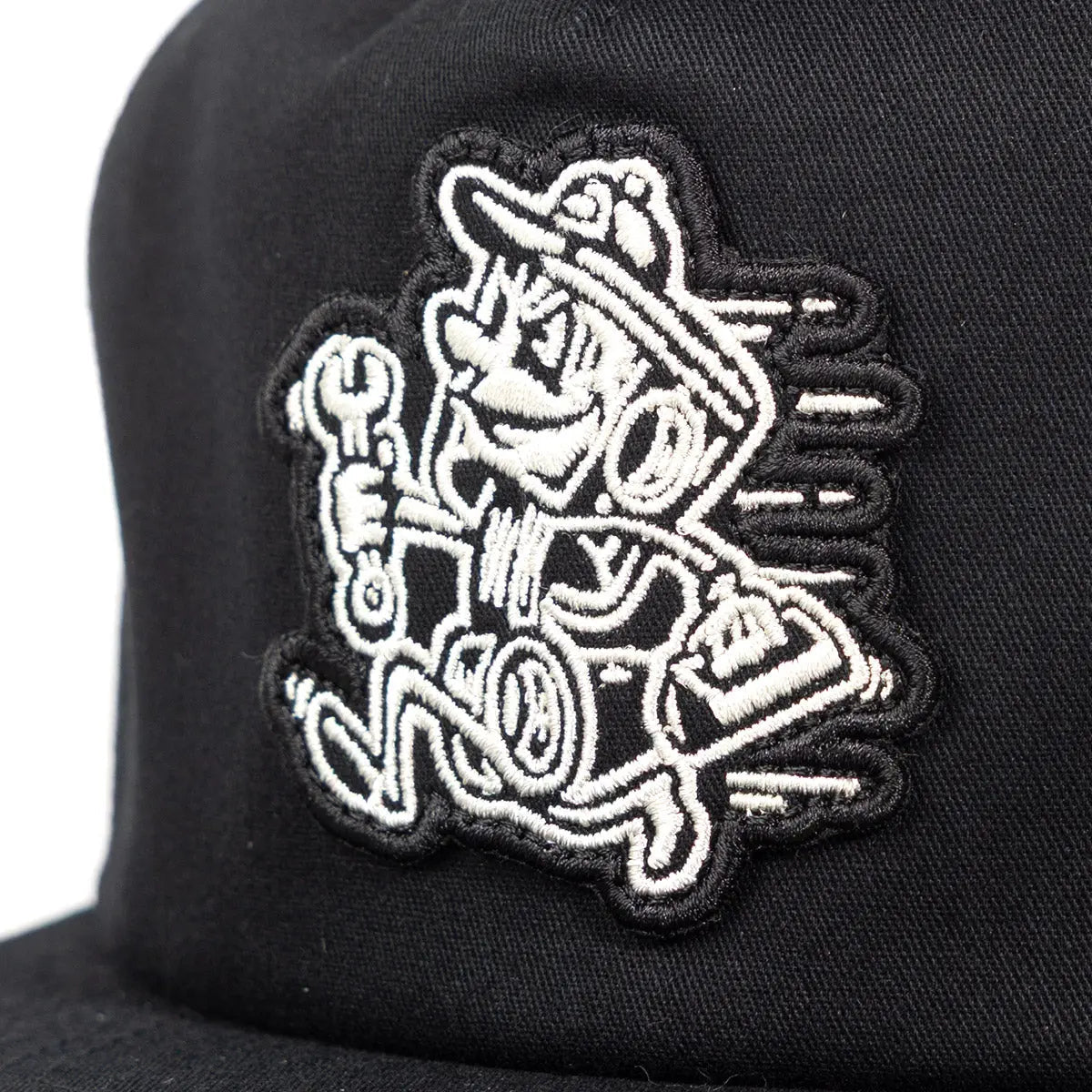 Back of Runner Hat Apparel Black Apparel, White embroidered mechanic character holding wrench with text on black cap back -