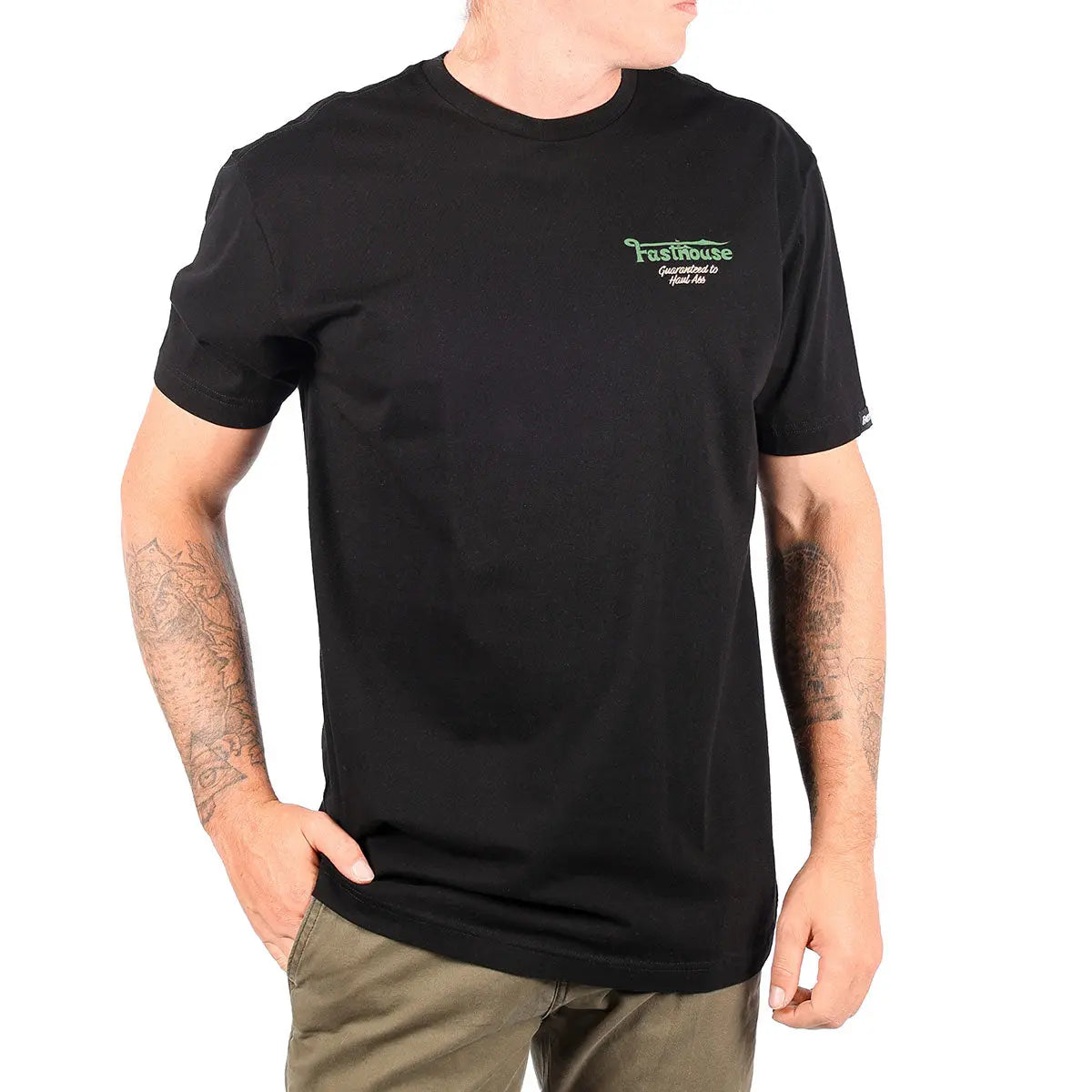 Person wearing Savanna Tee Black Black Tee, Man wearing black tee in casual indoor setting against white background -