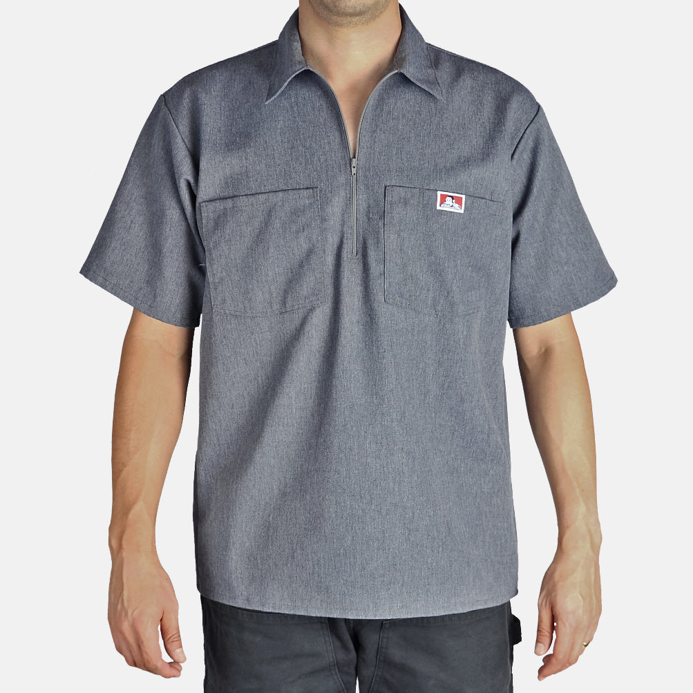 Person wearing Short Sleeve Solid Half Zip S/S Woven Black S/S Woven, Man wearing grey work shirt against neutral studio