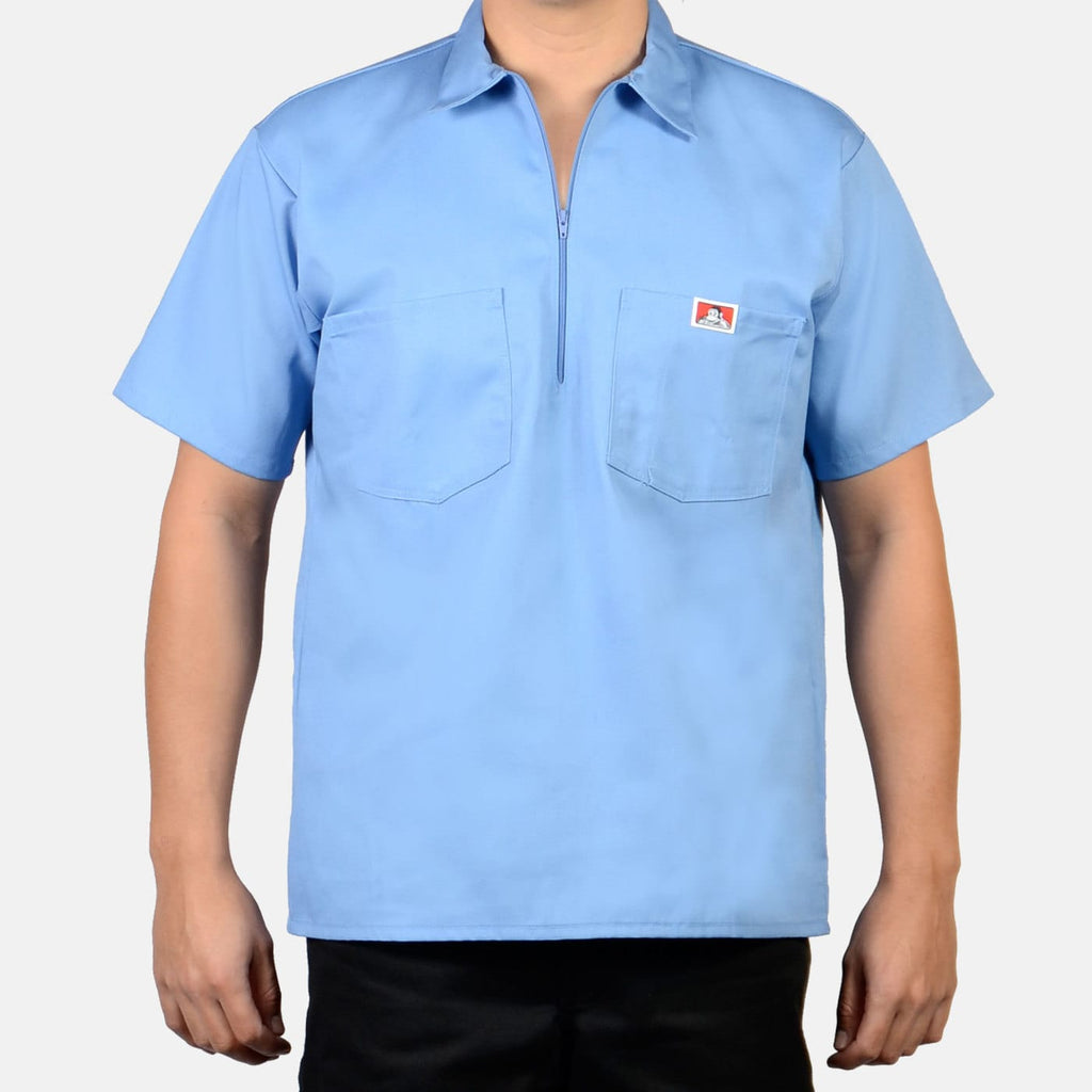 Person wearing Short Sleeve Solid Half Zip S/S Woven Black S/S Woven, Light blue short-sleeve work shirt with chest pockets