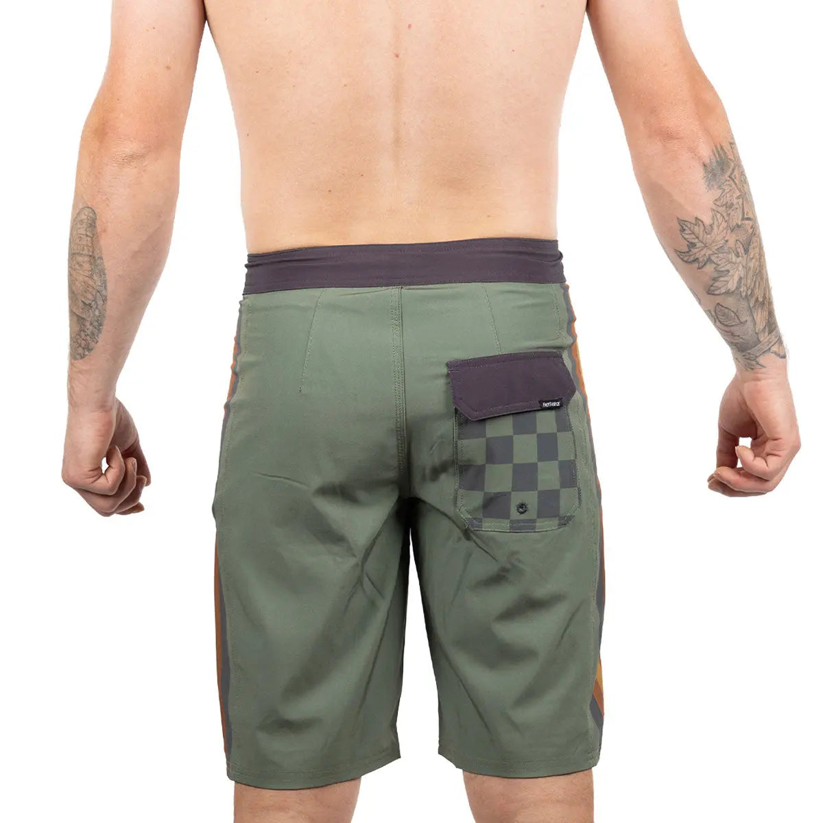 Person wearing Skeg 21" Boardshorts Apparel Olive Apparel, Wearer shown shirtless against neutral white background -