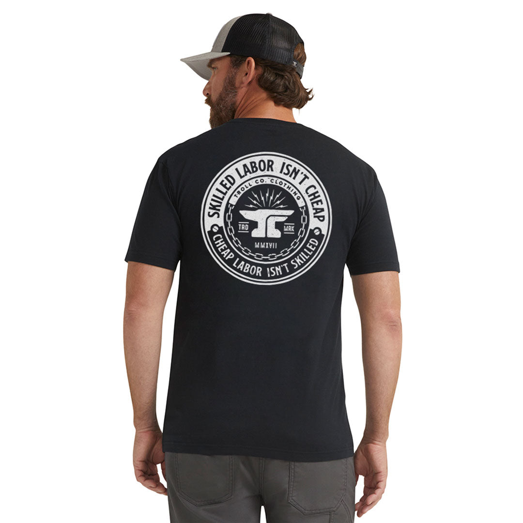 Person wearing Slic Black Tee, Man wearing black tee standing against plain white background - Slowride Supply