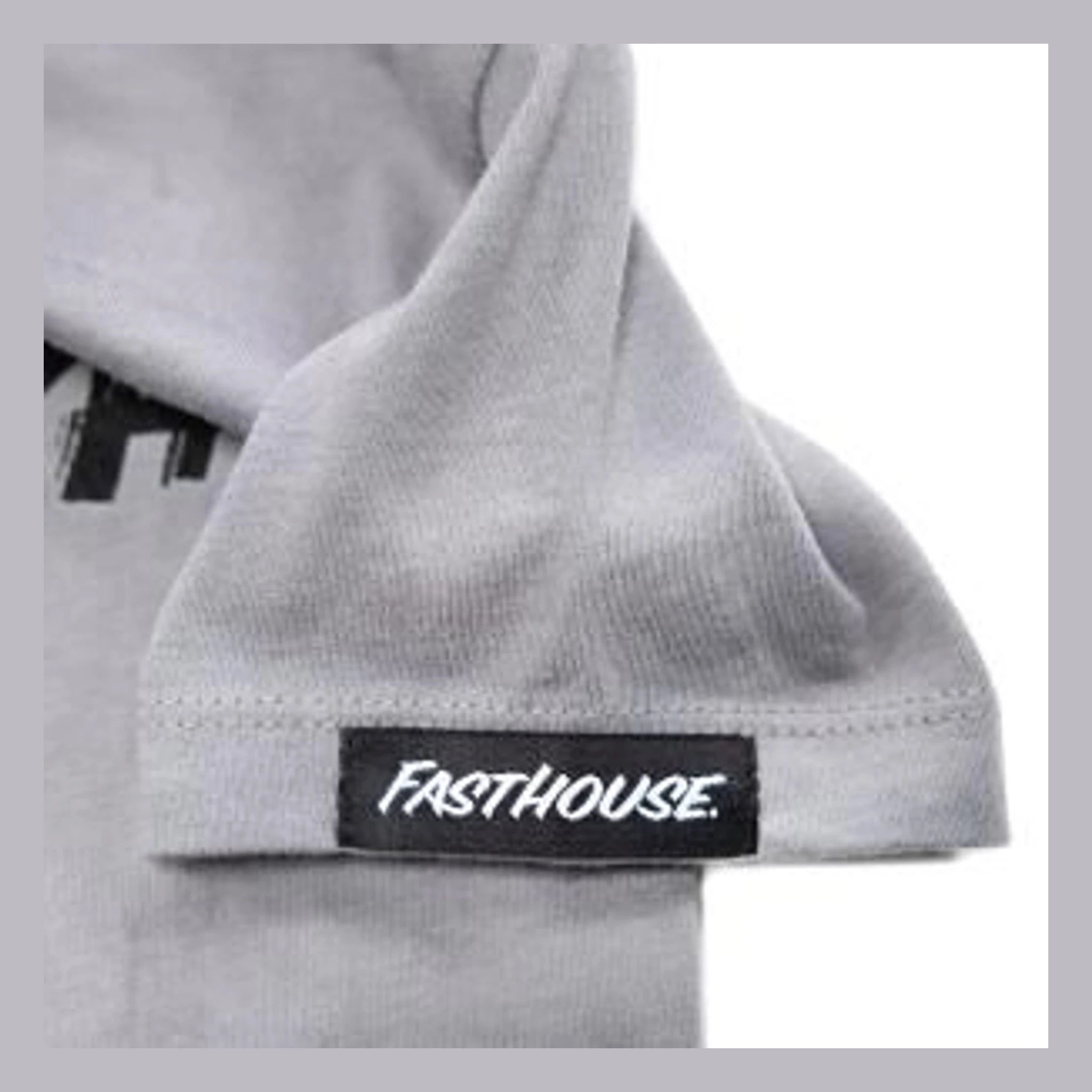 Close-up of Toddler Fray Tee Kids Light Gray Kids Tee showing Black woven label with white italic script on light gray