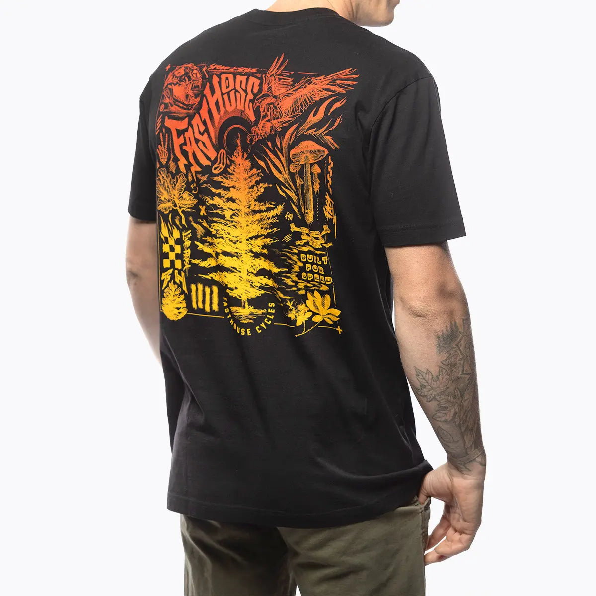 Person wearing Tomahawk Natural Tee, Man wearing black tee standing against plain white background - Slowride Supply