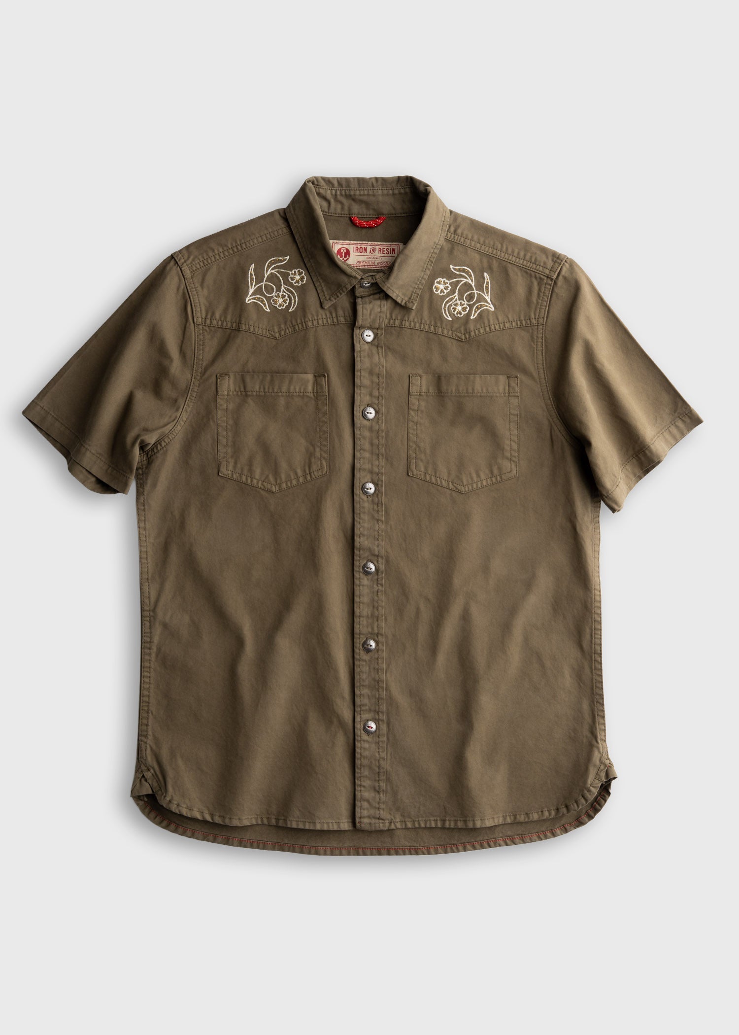 Westy Shirt S/S Woven front view, Light khaki with white winged engine embroideries on chest yoke and dual front pockets,