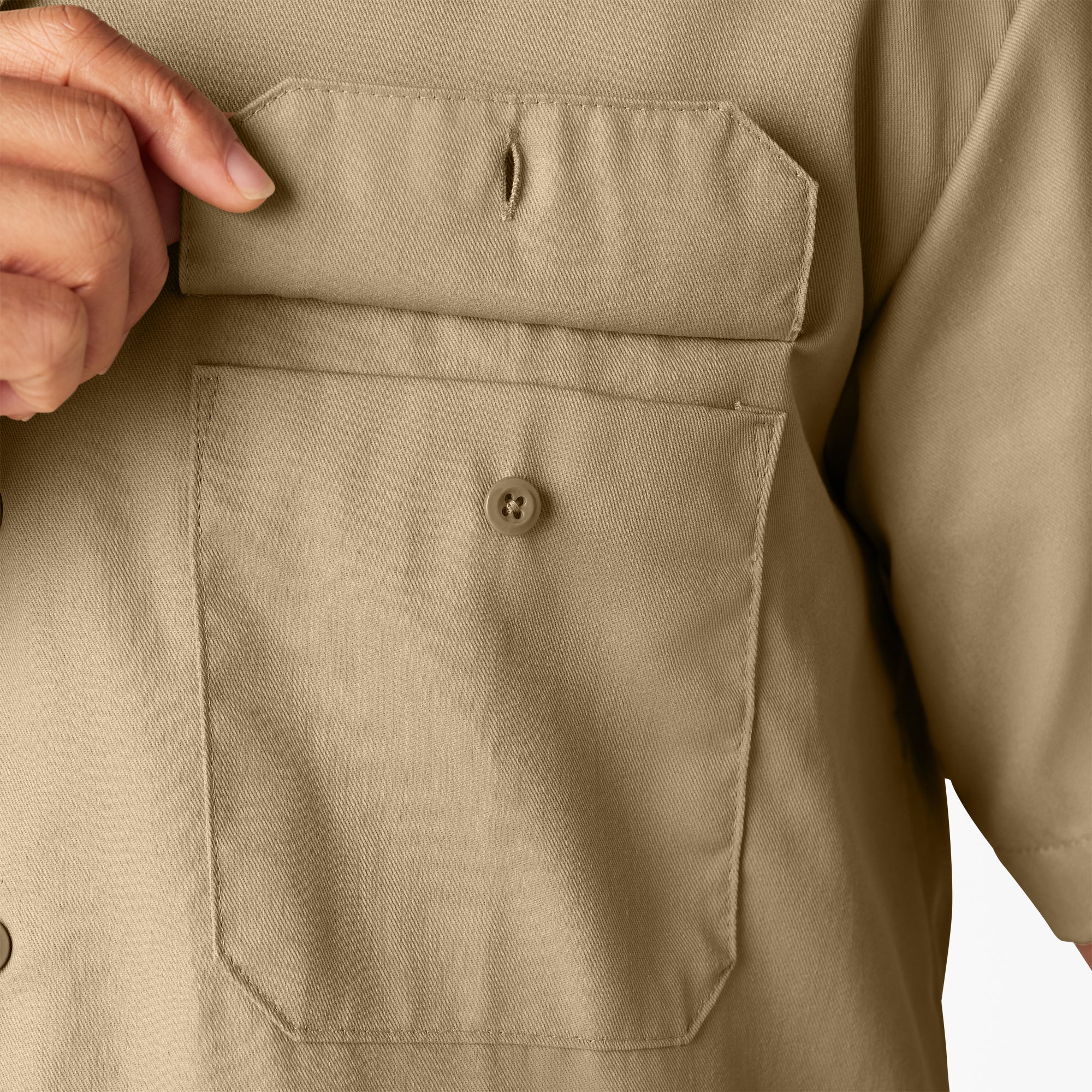 Close-up of Woven Twill Shirt S/S Woven Black S/S Woven showing Tan twill chest pocket with single button closure and
