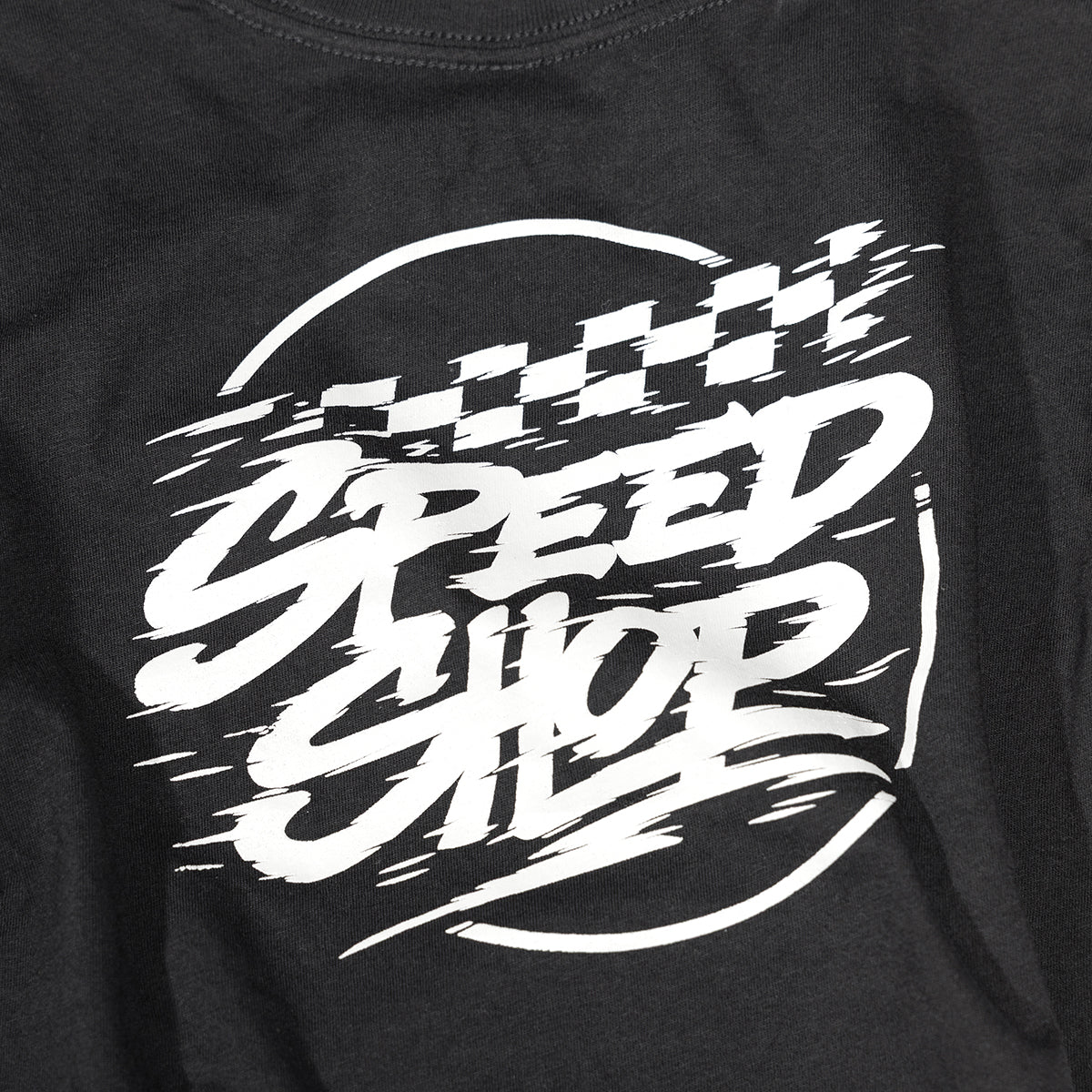 Close-up of Youth Burner Tee Kids Black Kids Tee showing White speed-themed graphic with checkered flag and motion lines