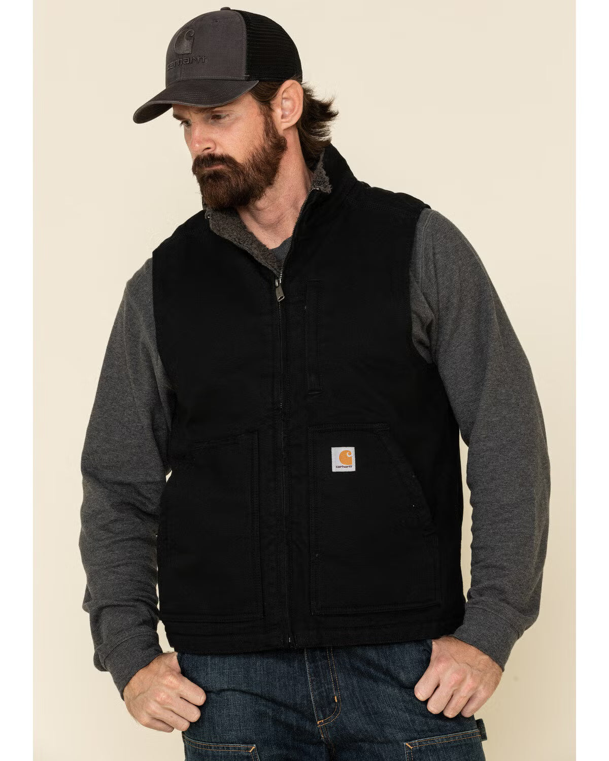 Person wearing 104277 Mock Neck Sherpa Lined Vest Dark Brown Vest, Man wearing black vest with charcoal long-sleeve shirt in