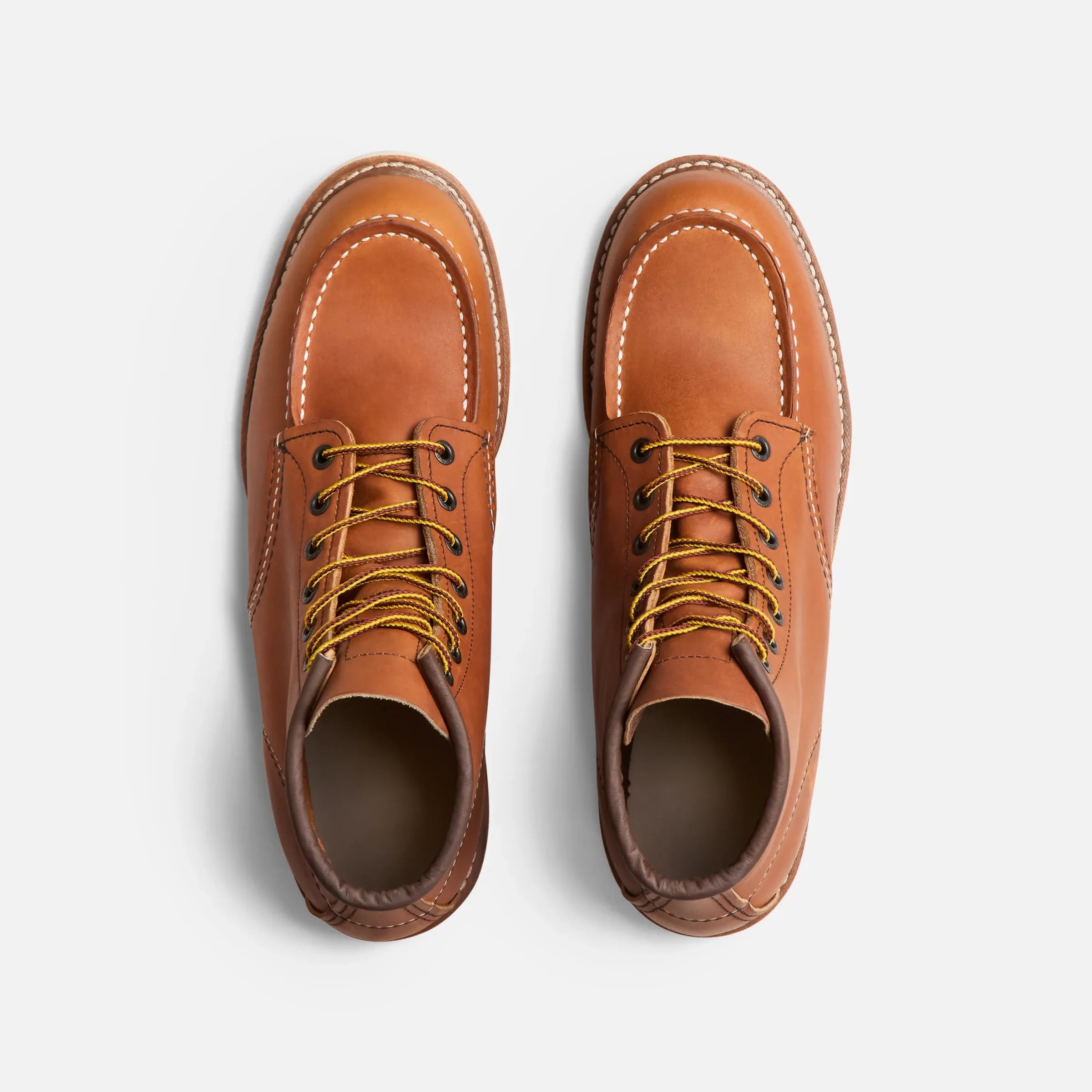 Back of 10875- Traction Tred Boots Boots, Tan leather boot with contrasting white stitching and yellow laces from above -