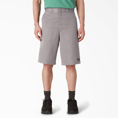 Person wearing 42283 13" Loose Fit Work Short Shorts Silver Shorts, Man wearing gray shorts and green shirt standing against
