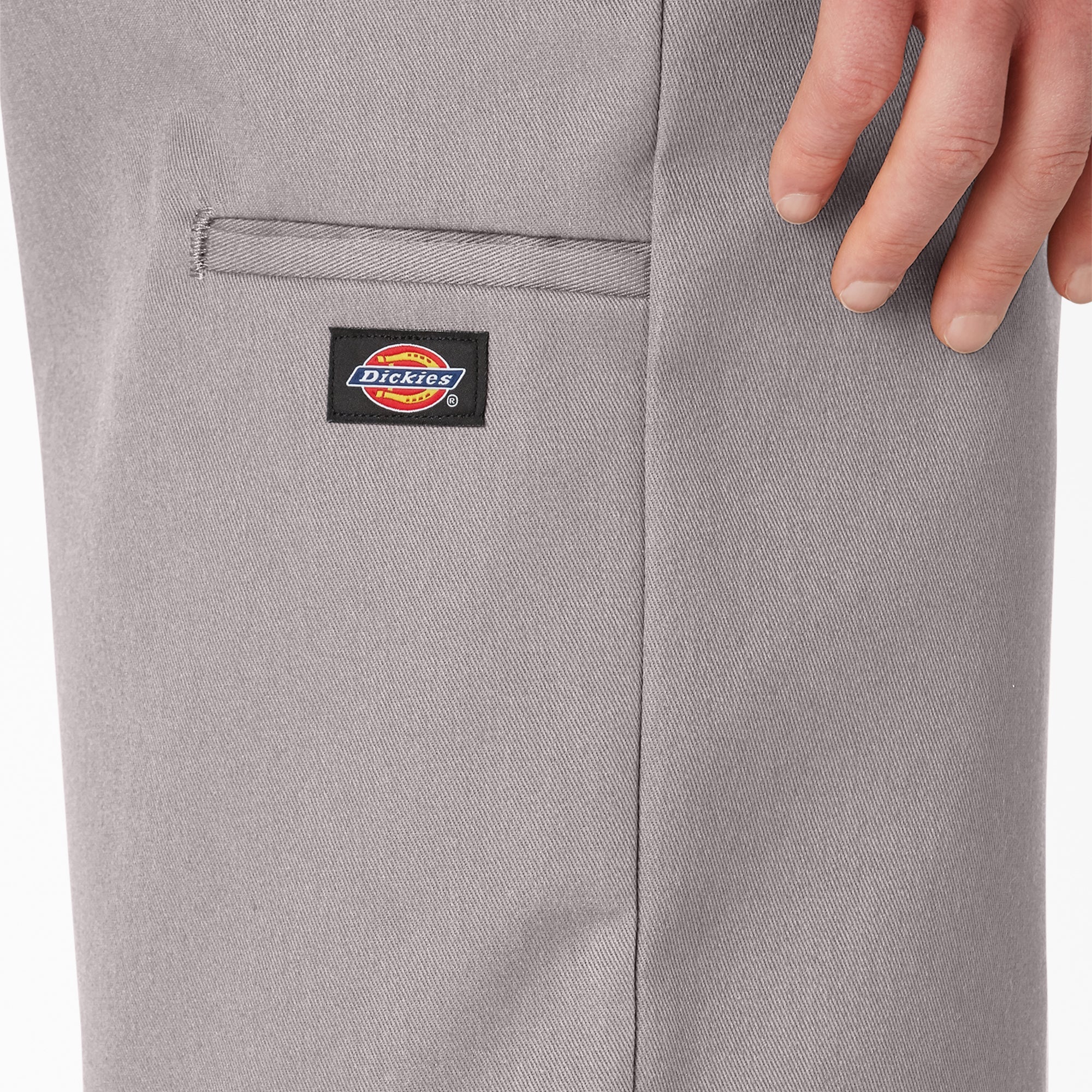 Close-up of 42283 13" Loose Fit Work Short Shorts Silver Shorts showing Woven brand label with red and blue logo on black